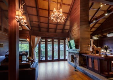 a room with a television and a fireplace