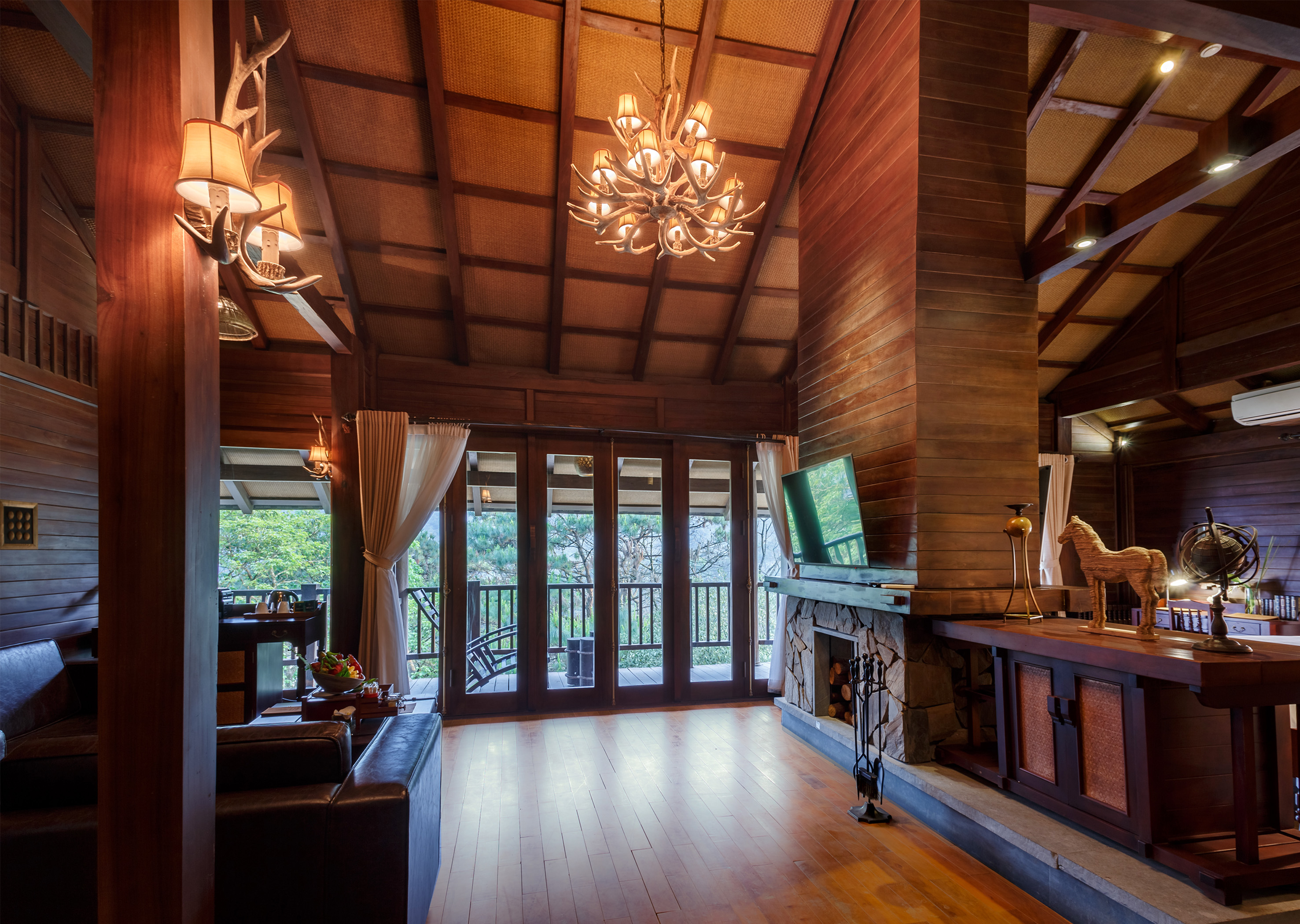 a room with a television and a fireplace