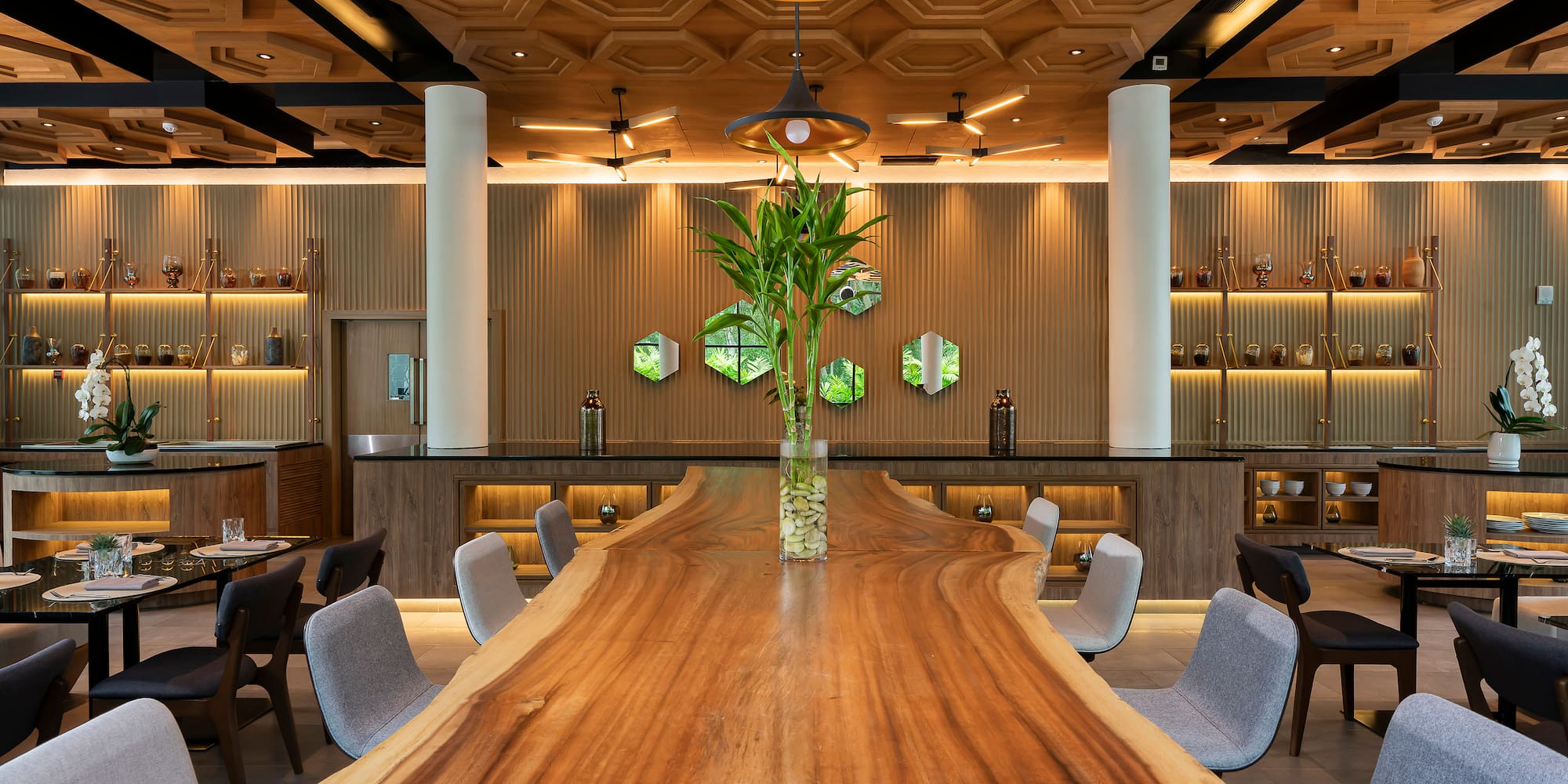 a room with a long table and chairs