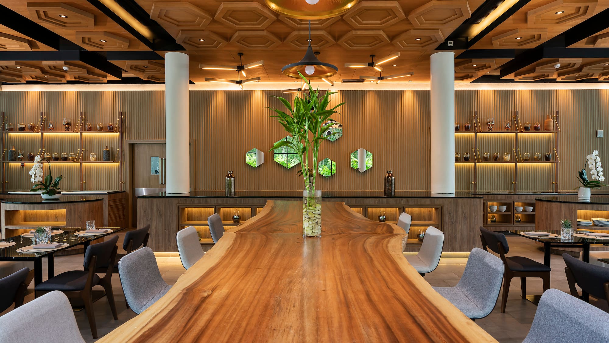 a room with a long table and chairs