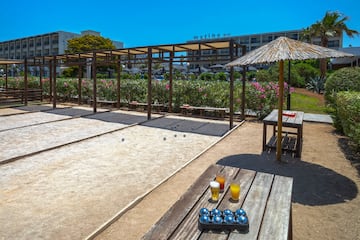 a table with a game of bocce balls and a table with drinks