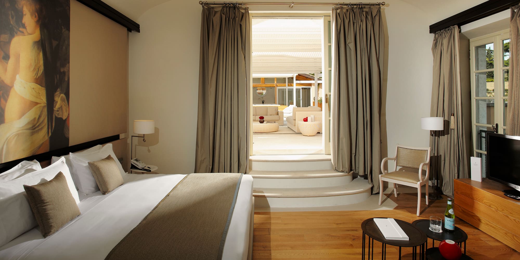 a bedroom with a bed and a chair