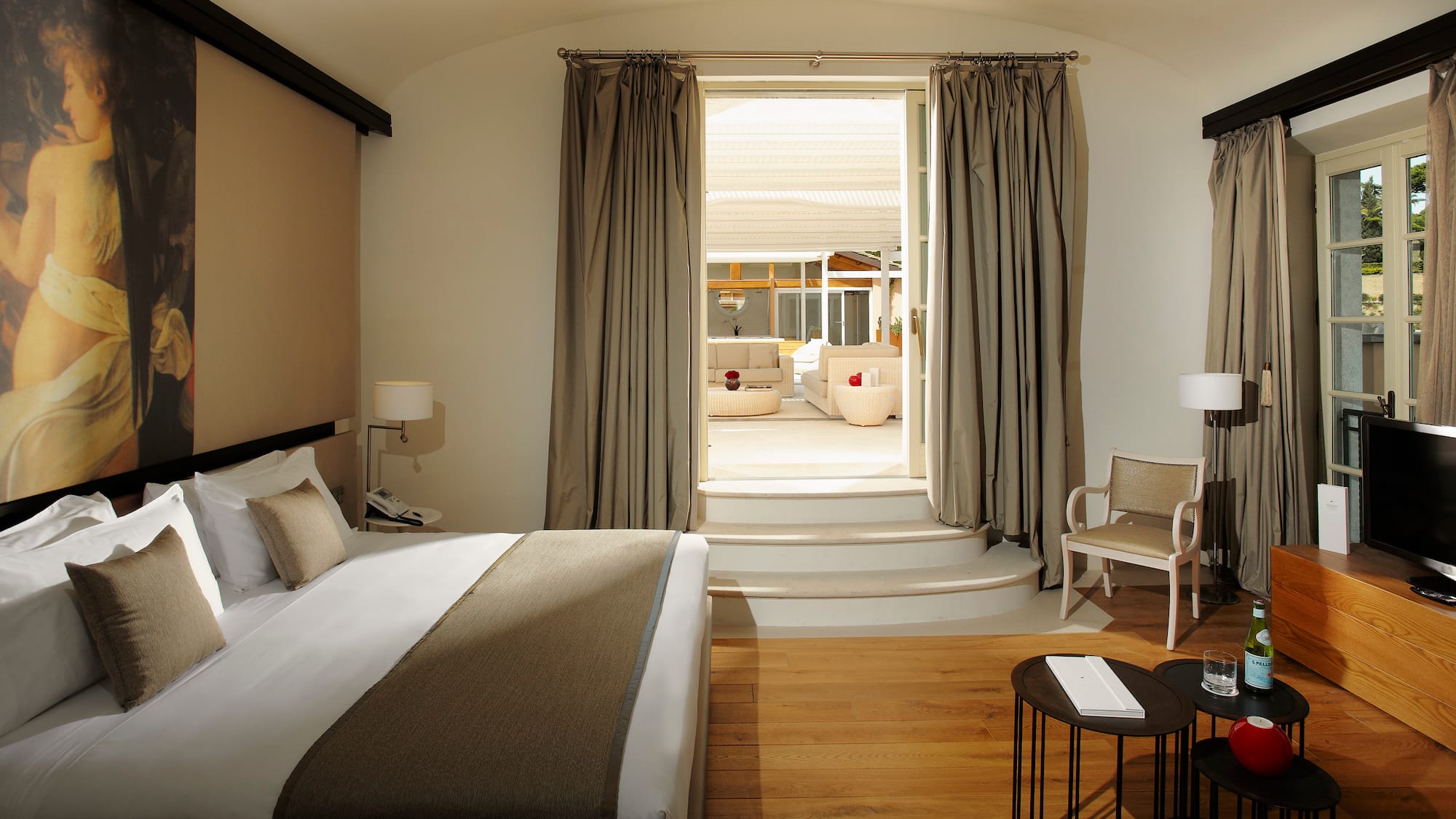 a bedroom with a bed and a chair