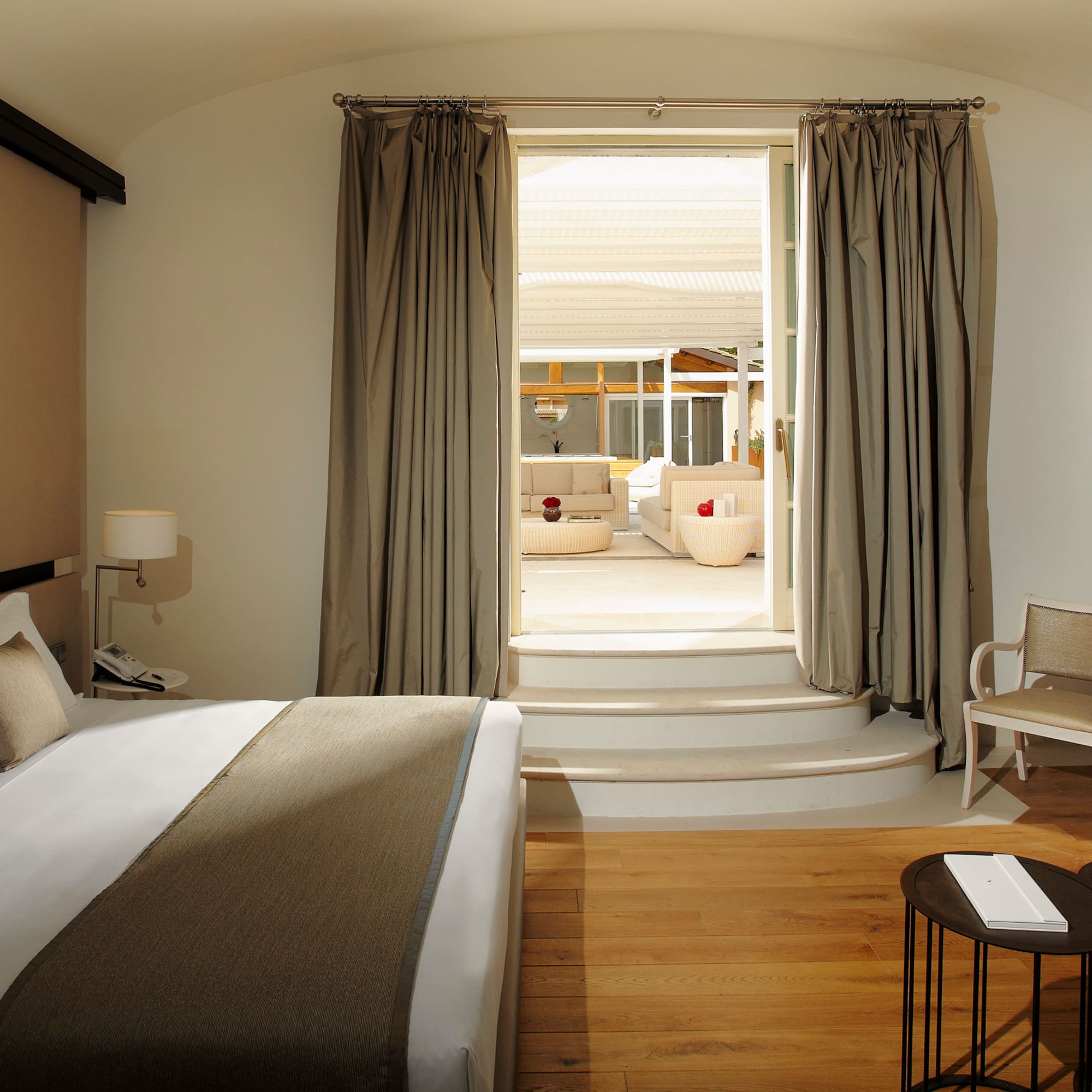 a bedroom with a bed and a chair