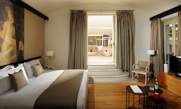 a bedroom with a bed and a chair