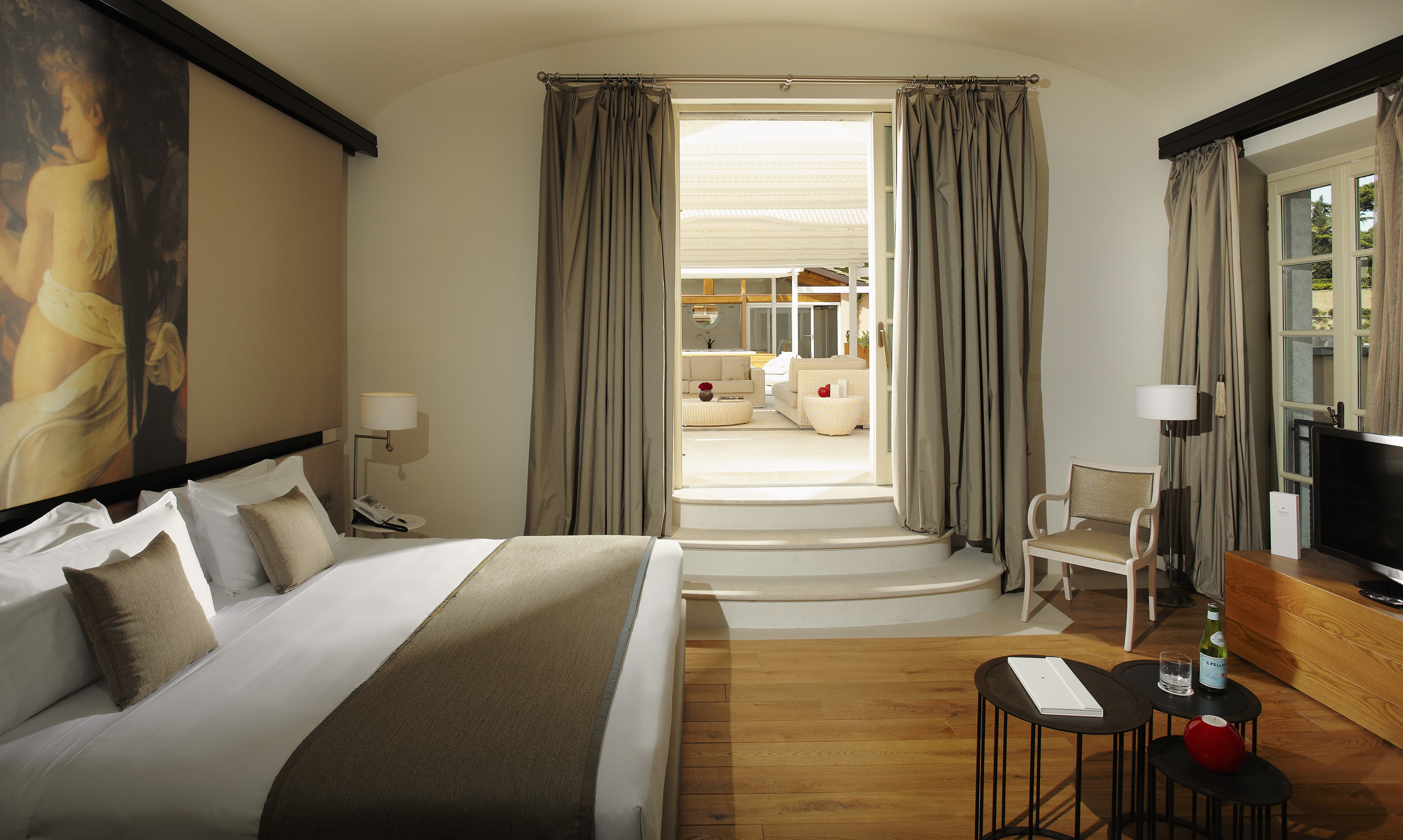 a bedroom with a bed and a chair