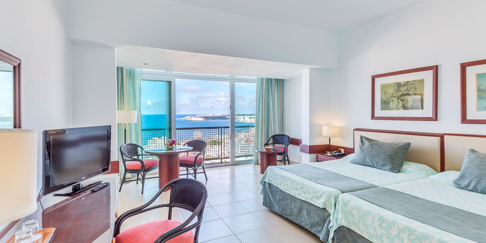 a room with a television and a bed