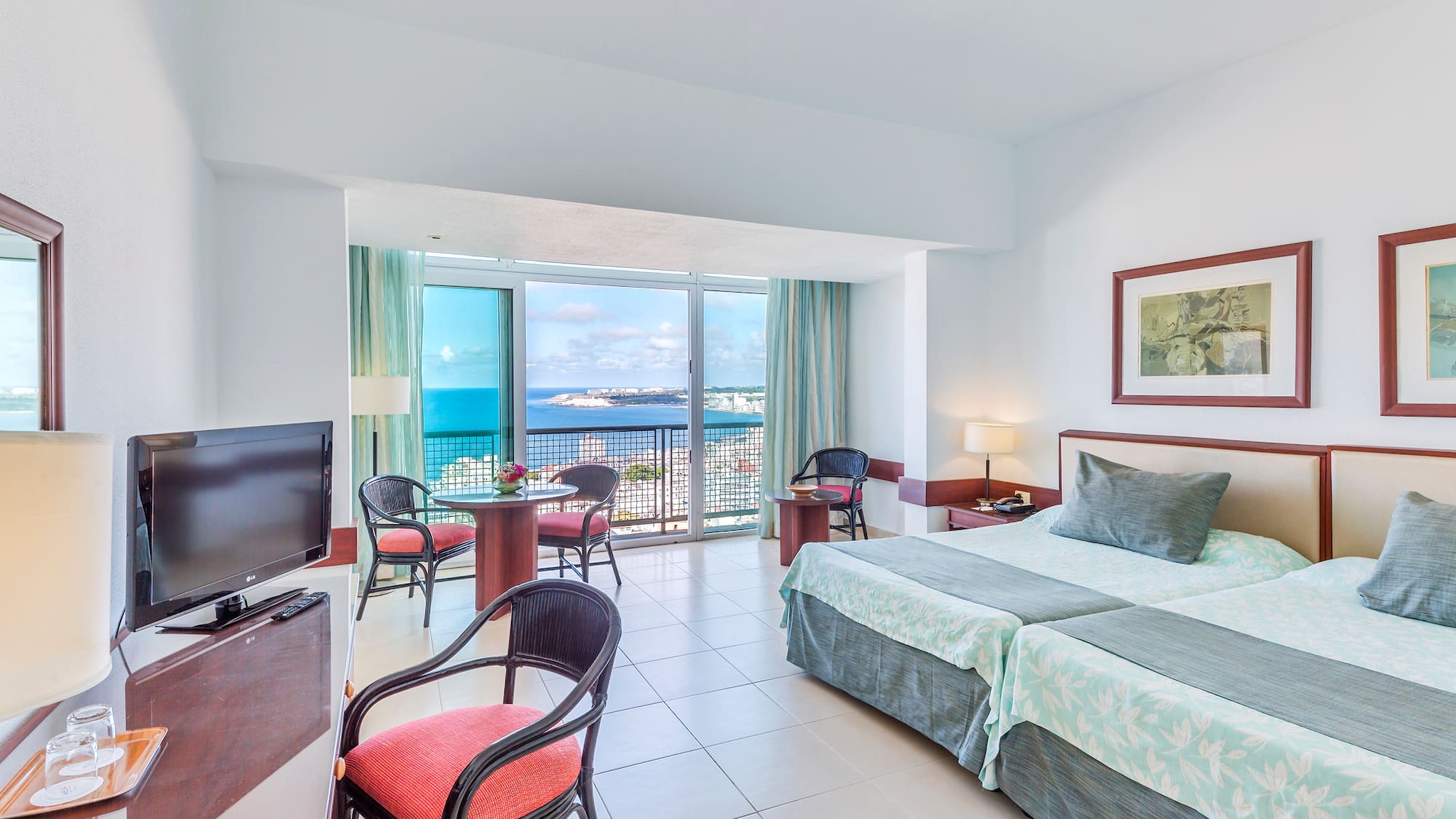 a room with a television and a bed