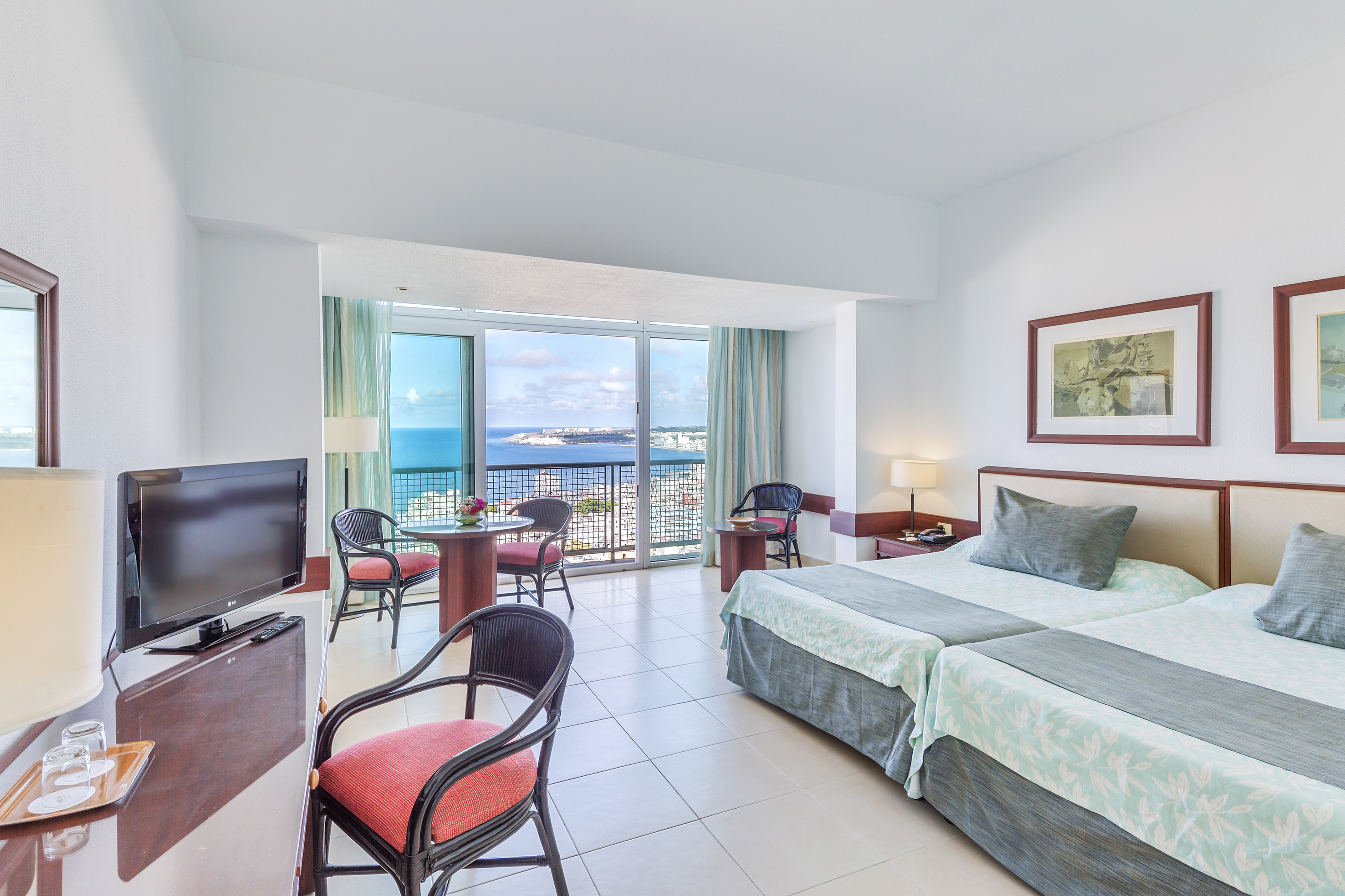 a room with a television and a bed