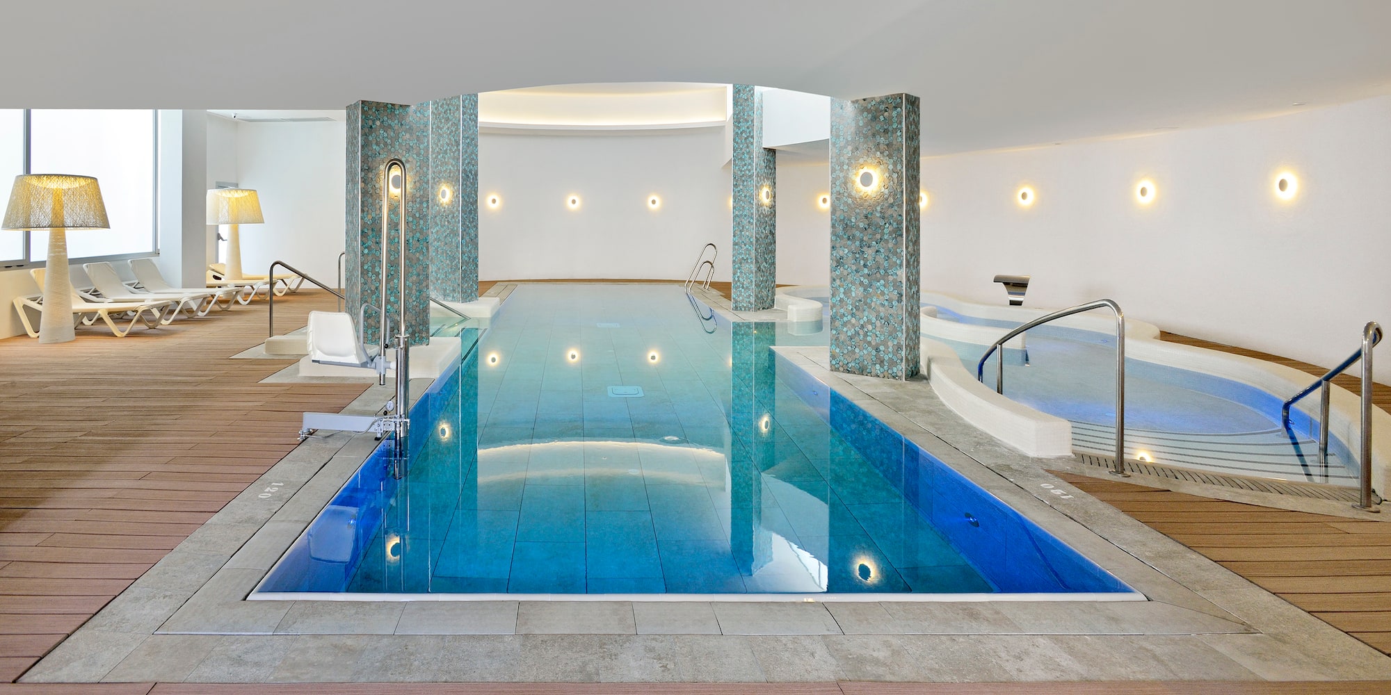 a indoor pool with a large body of water
