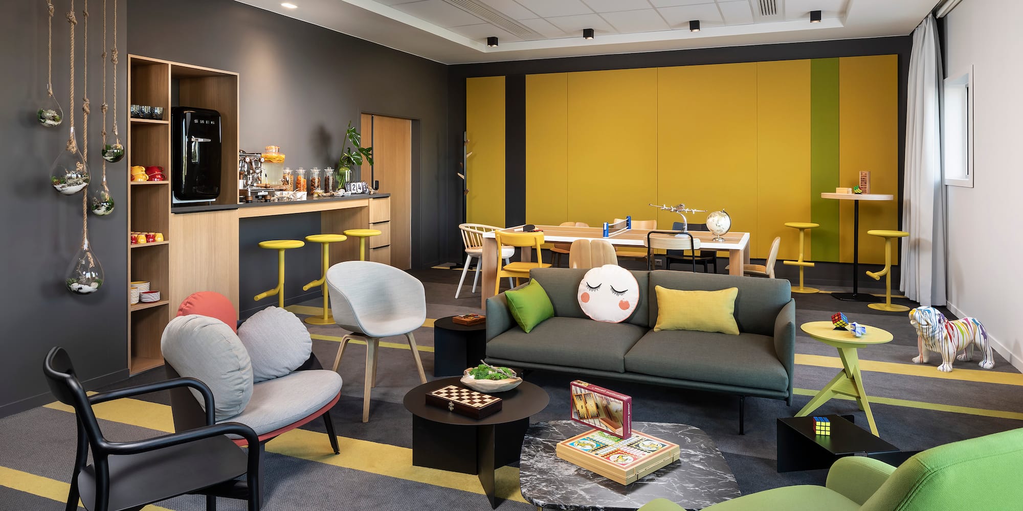 a room with a couch and chairs