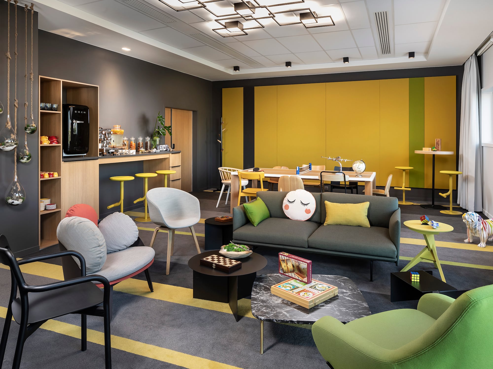 a room with a couch and chairs