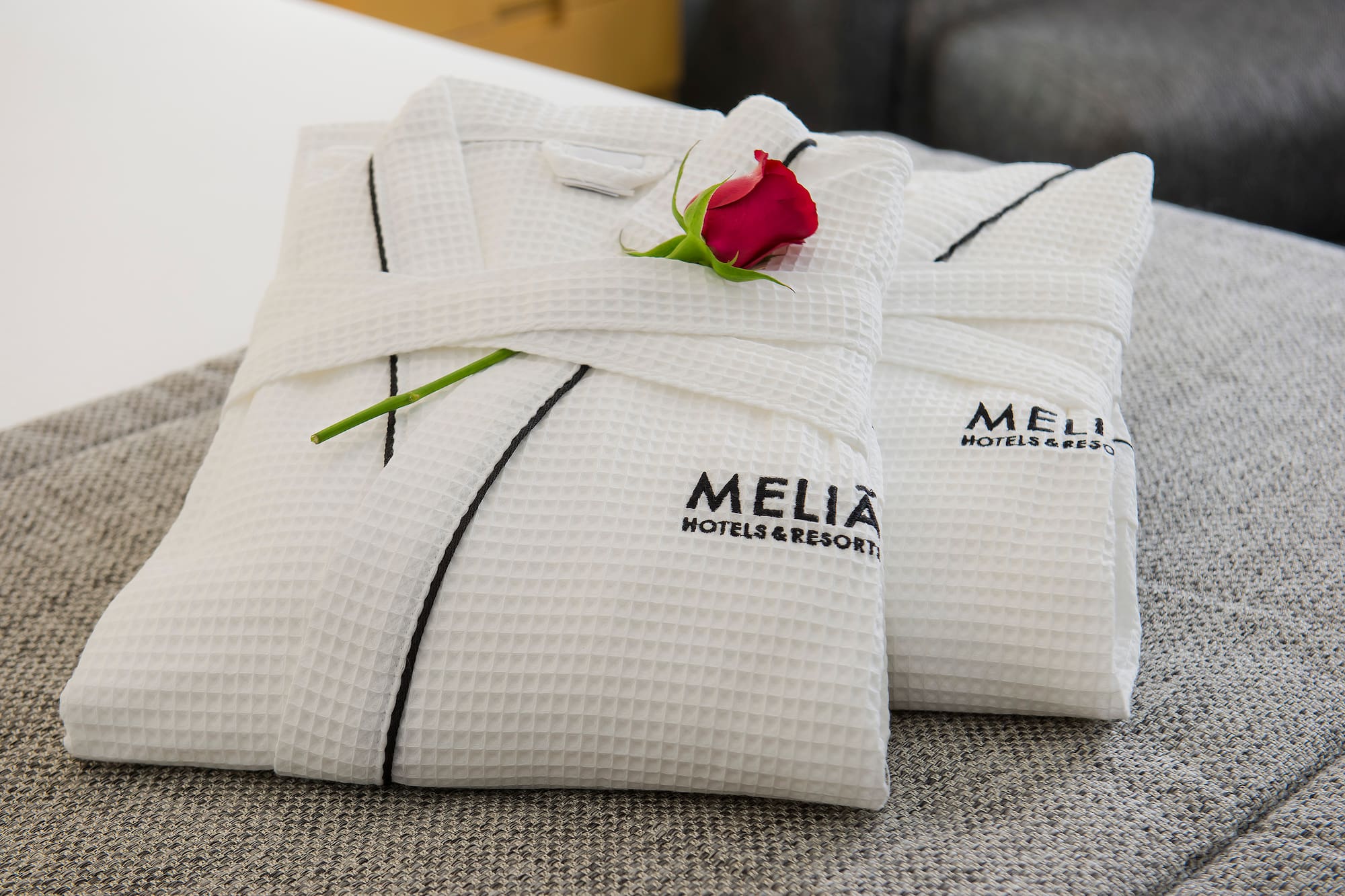 a white towels with a rose on it