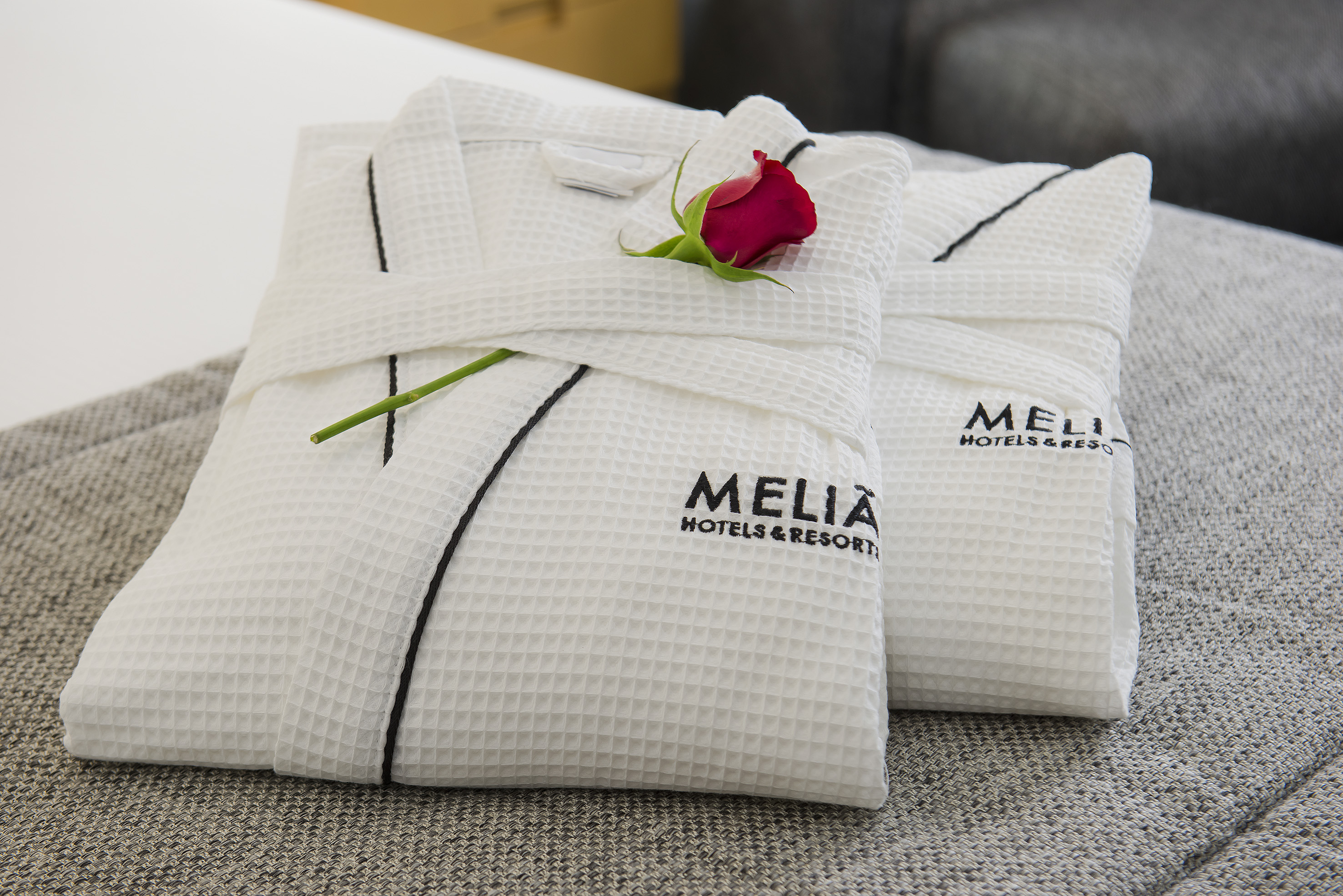 a white towels with a rose on it