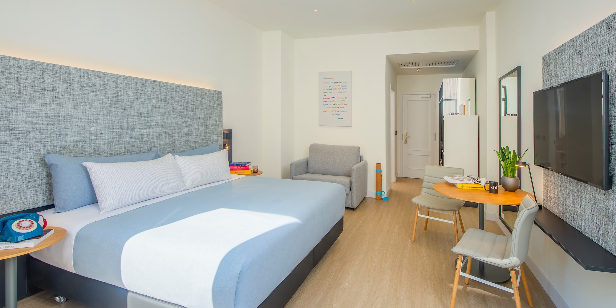 a bedroom with a bed and a table