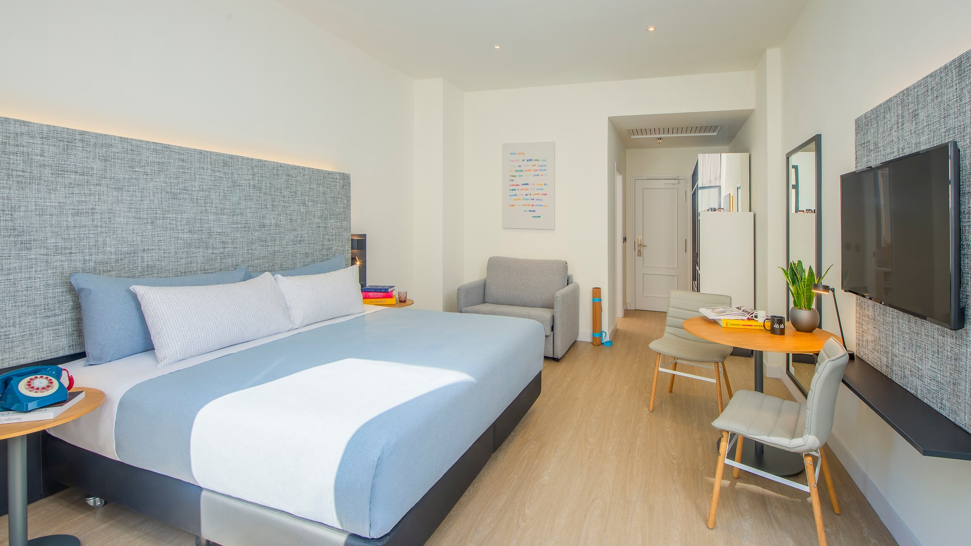 a bedroom with a bed and a table