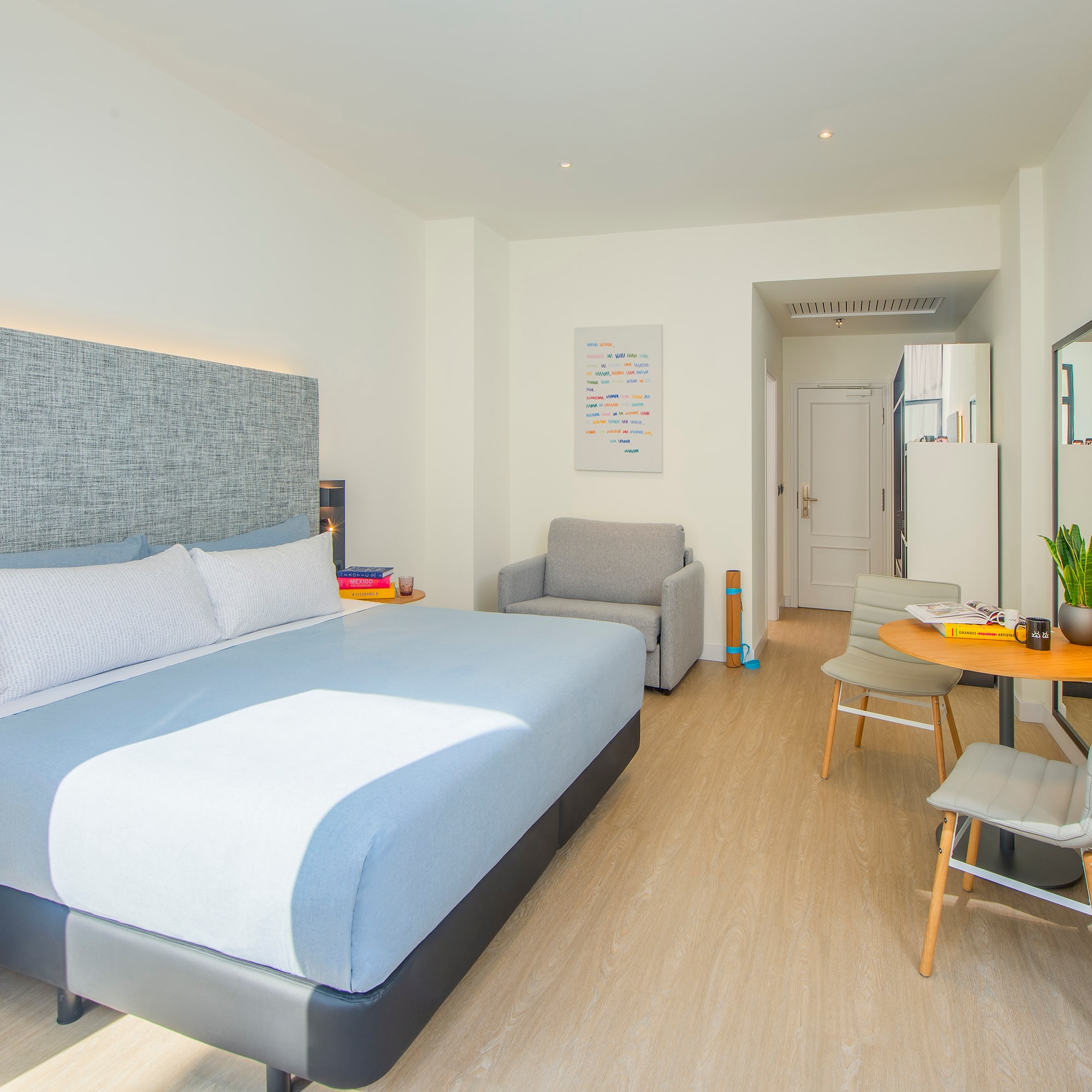 a bedroom with a bed and a table