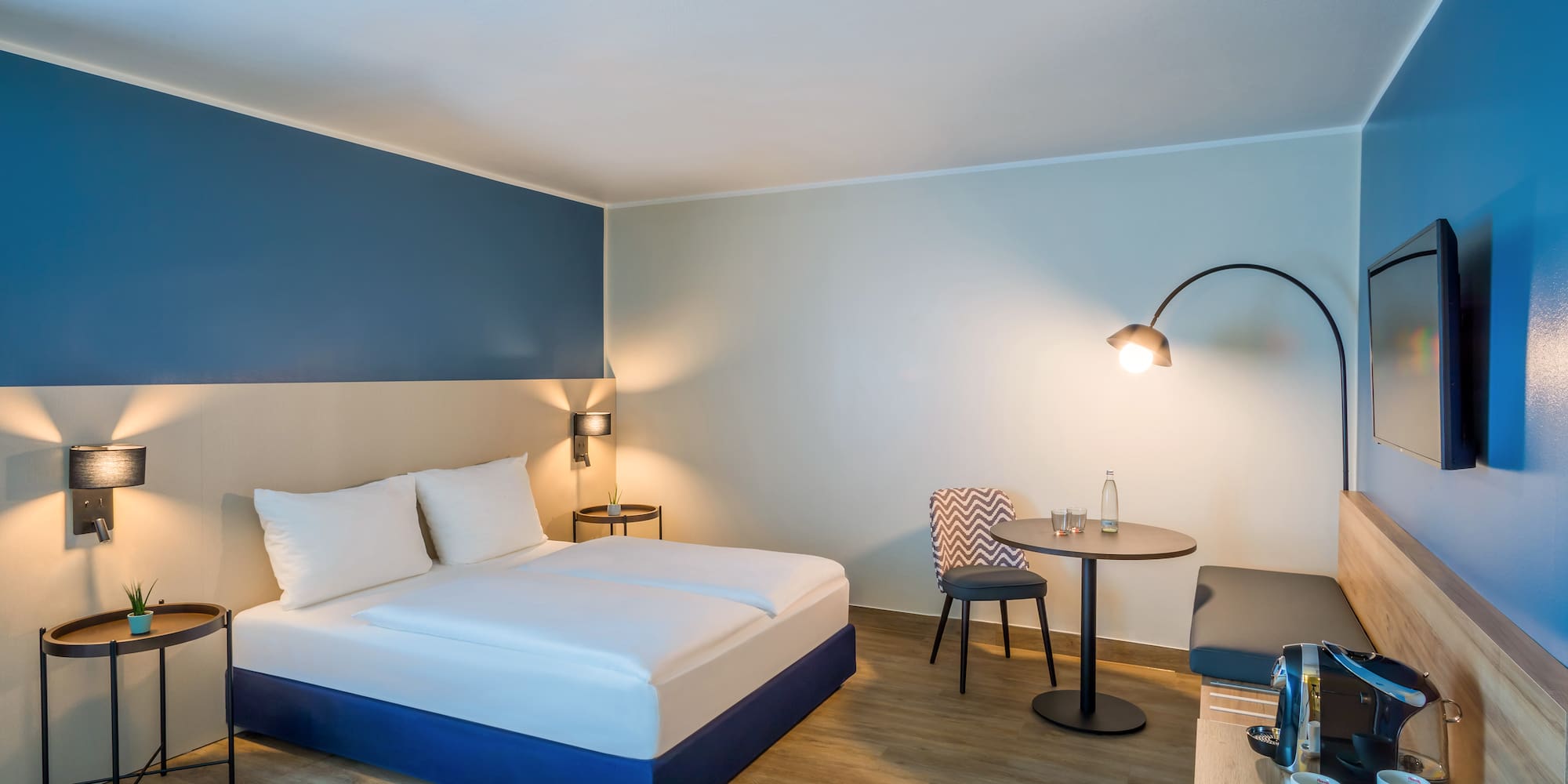 a room with a bed and a table