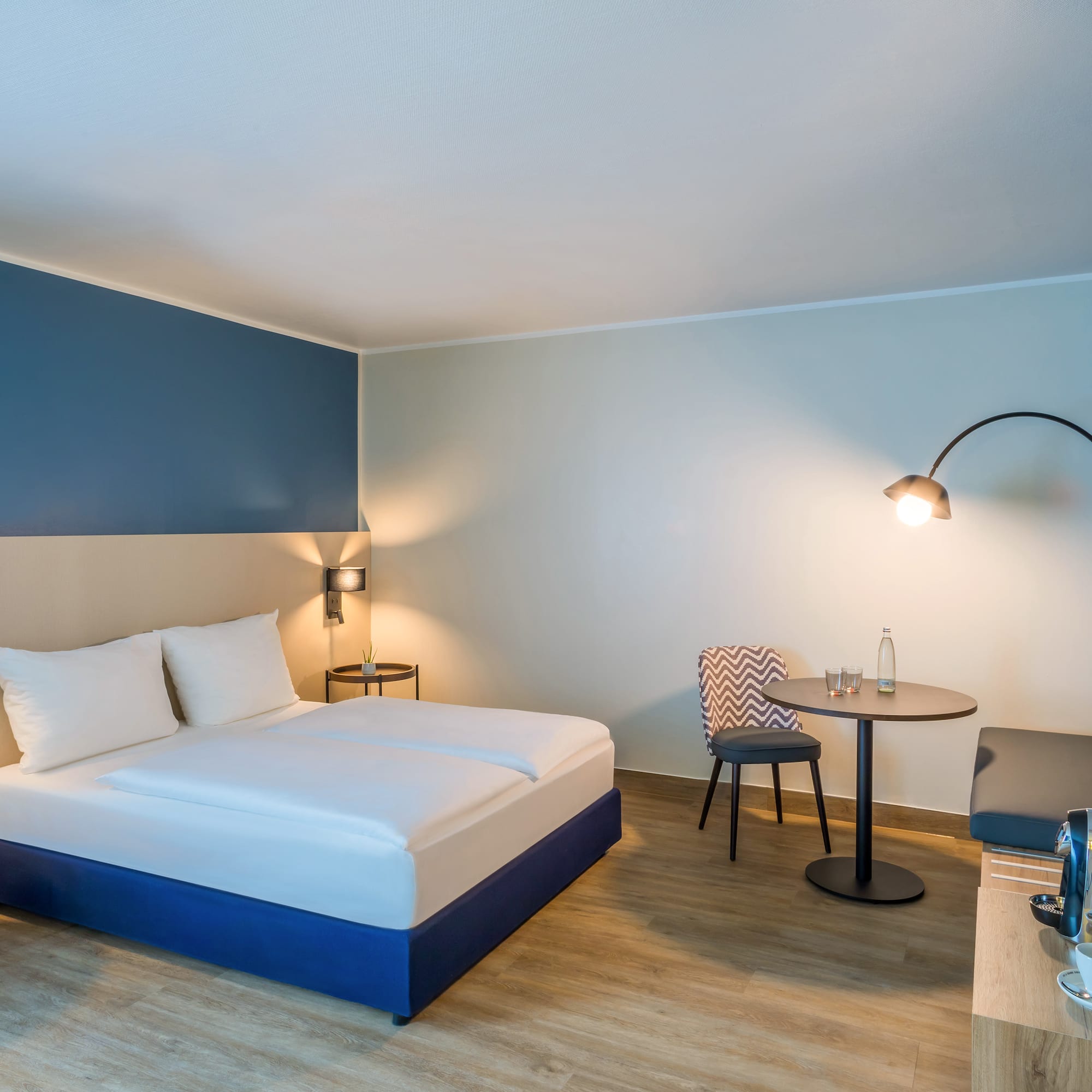 a room with a bed and a table