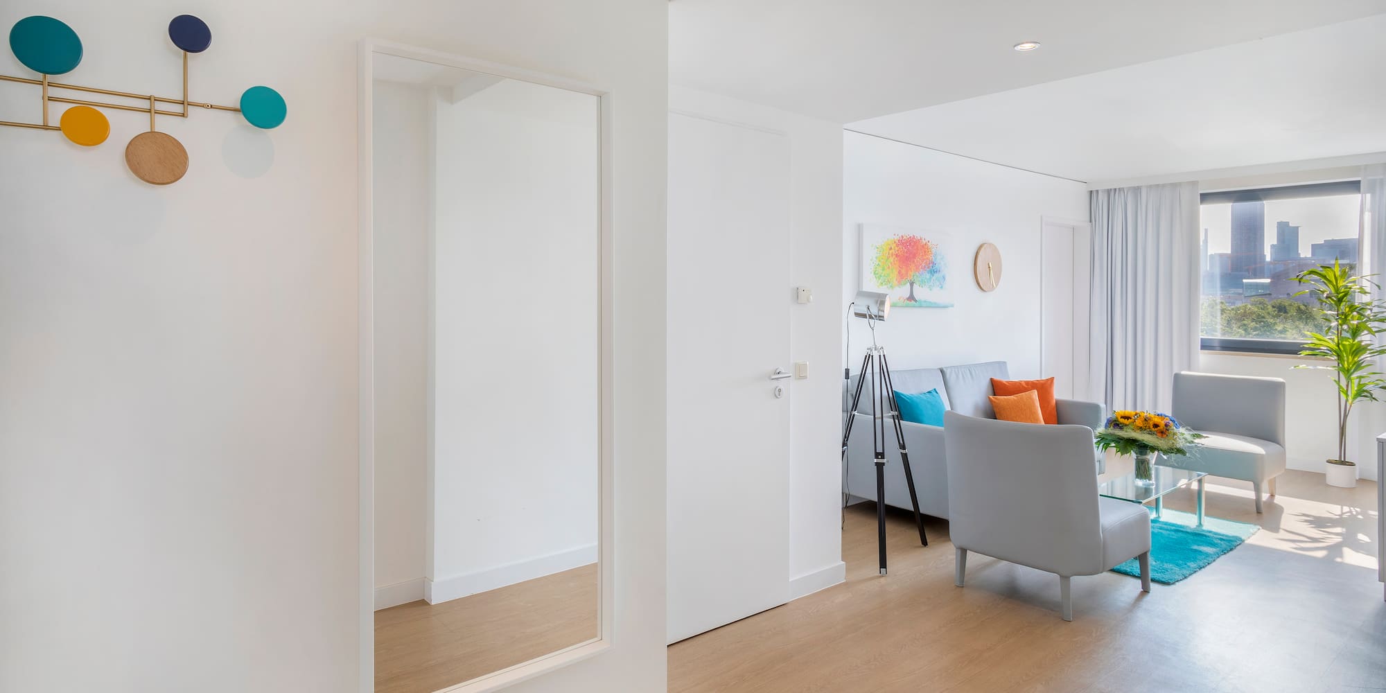 a room with a mirror and a couch