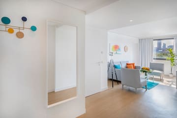 a room with a mirror and a couch