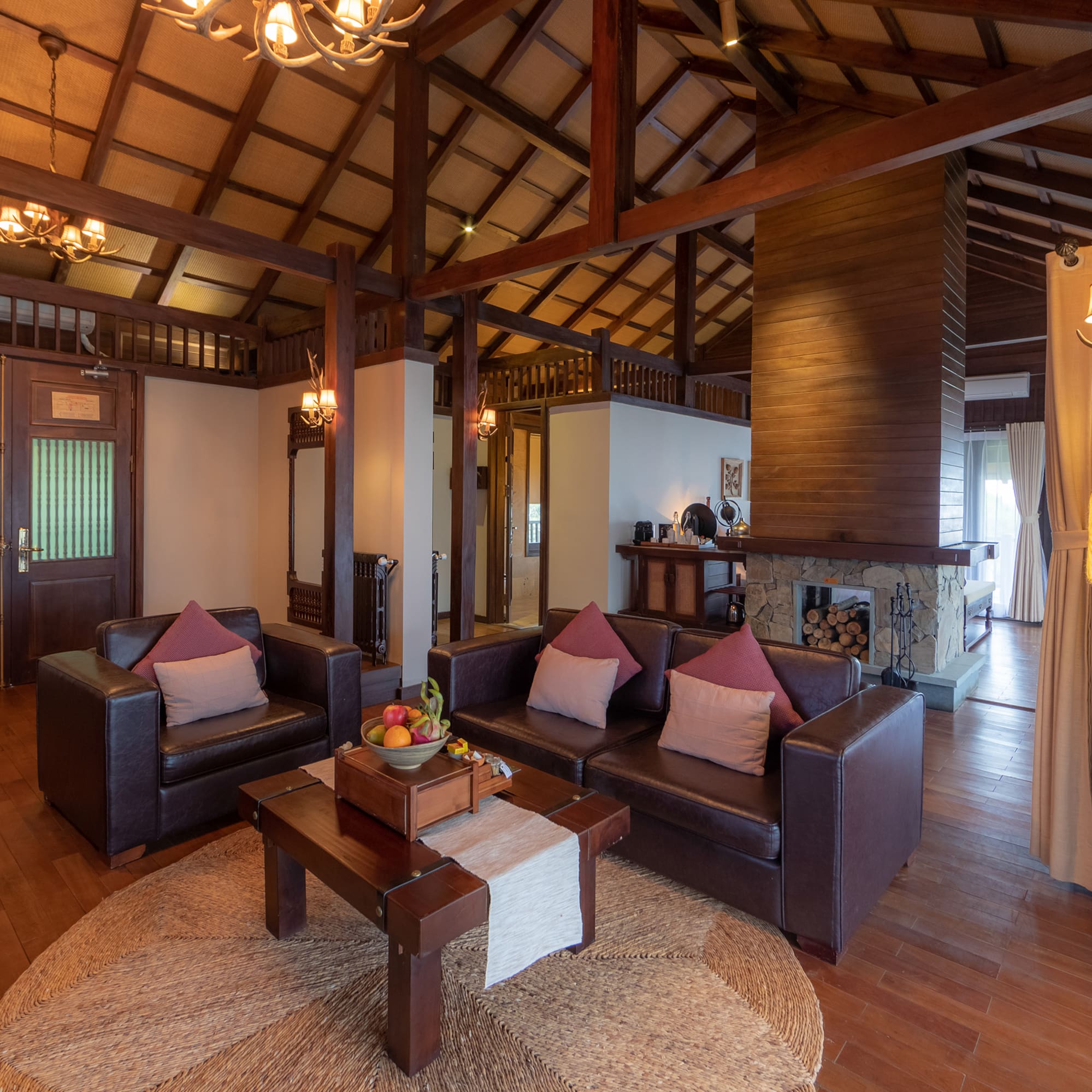 a living room with a fireplace and couches