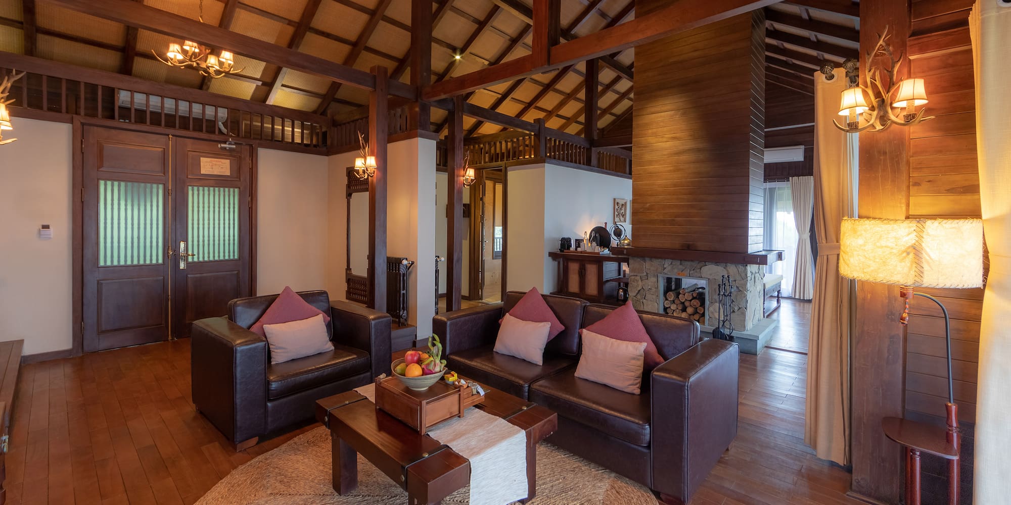 a living room with a fireplace and couches