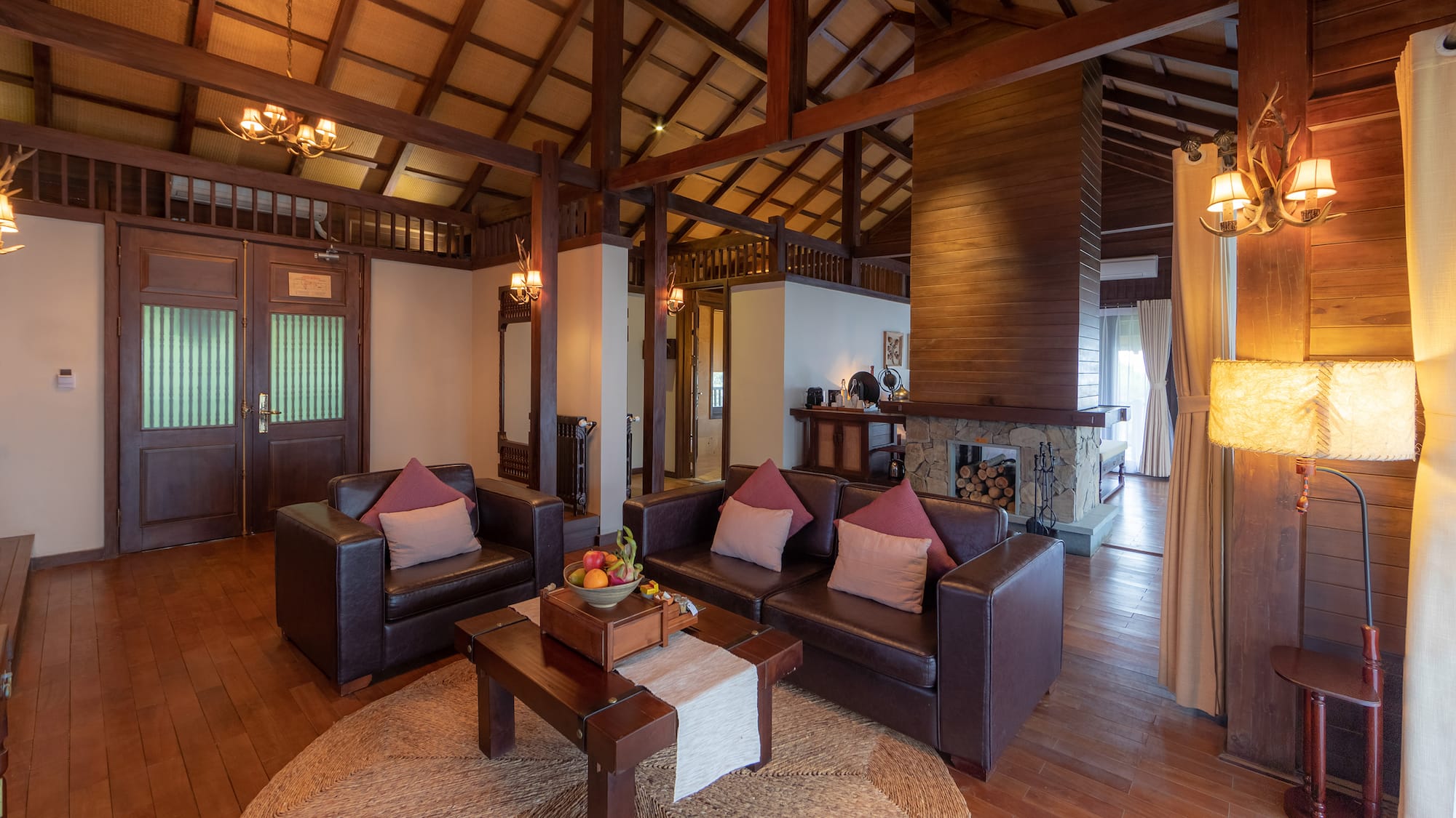 a living room with a fireplace and couches