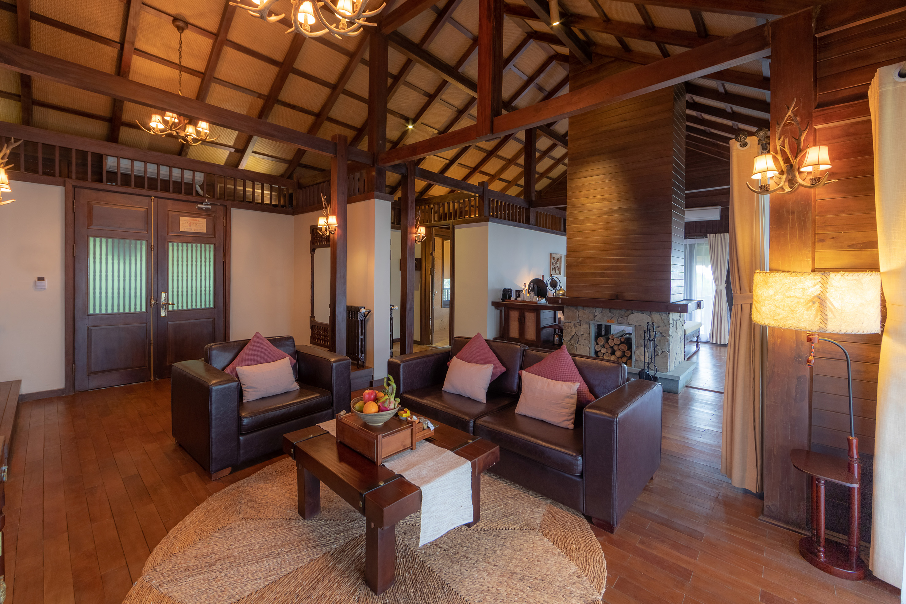 a living room with a fireplace and couches