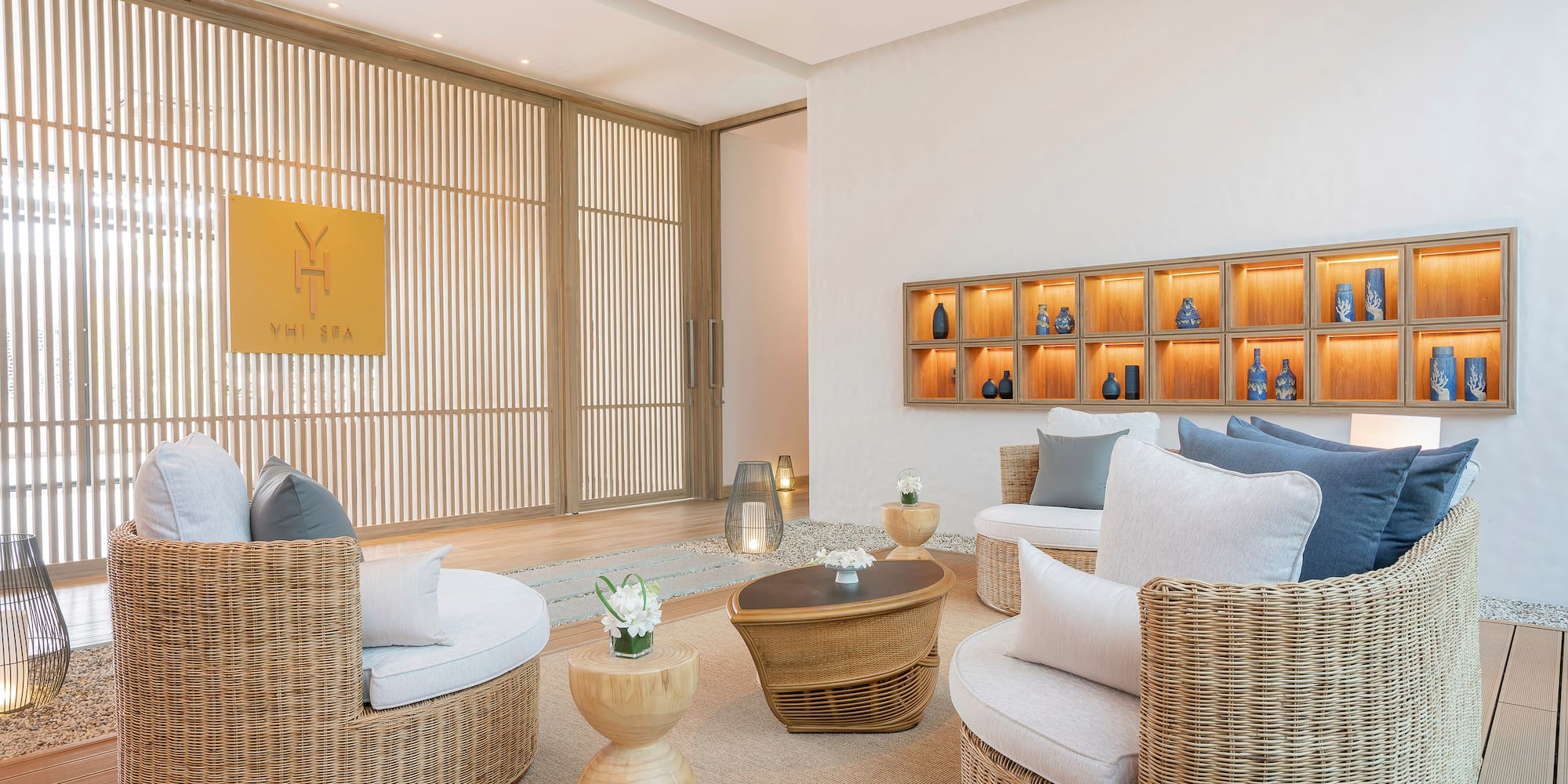 a room with wicker furniture and a table