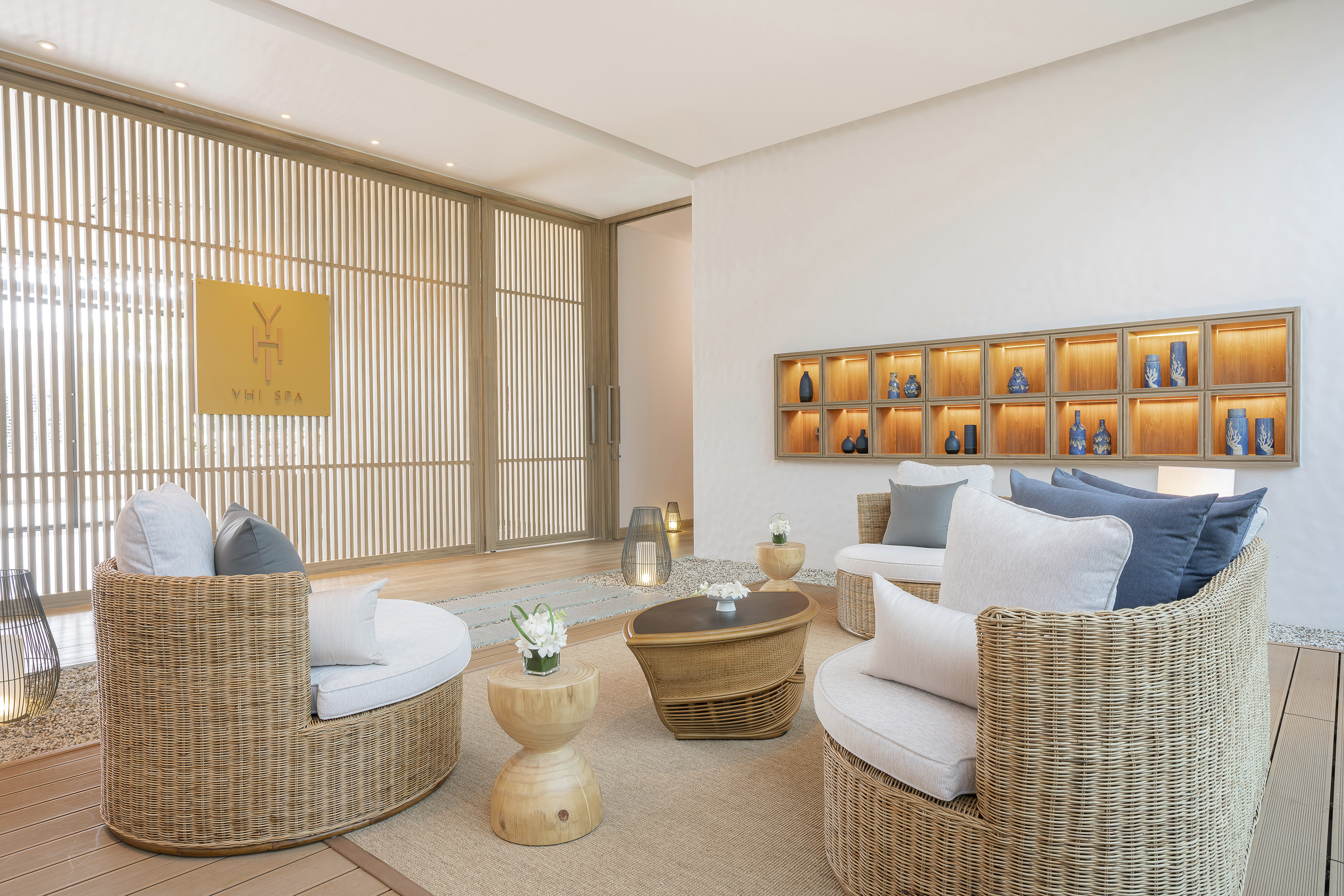 Serene YHI Spa interior with rattan seating and modern wood details.