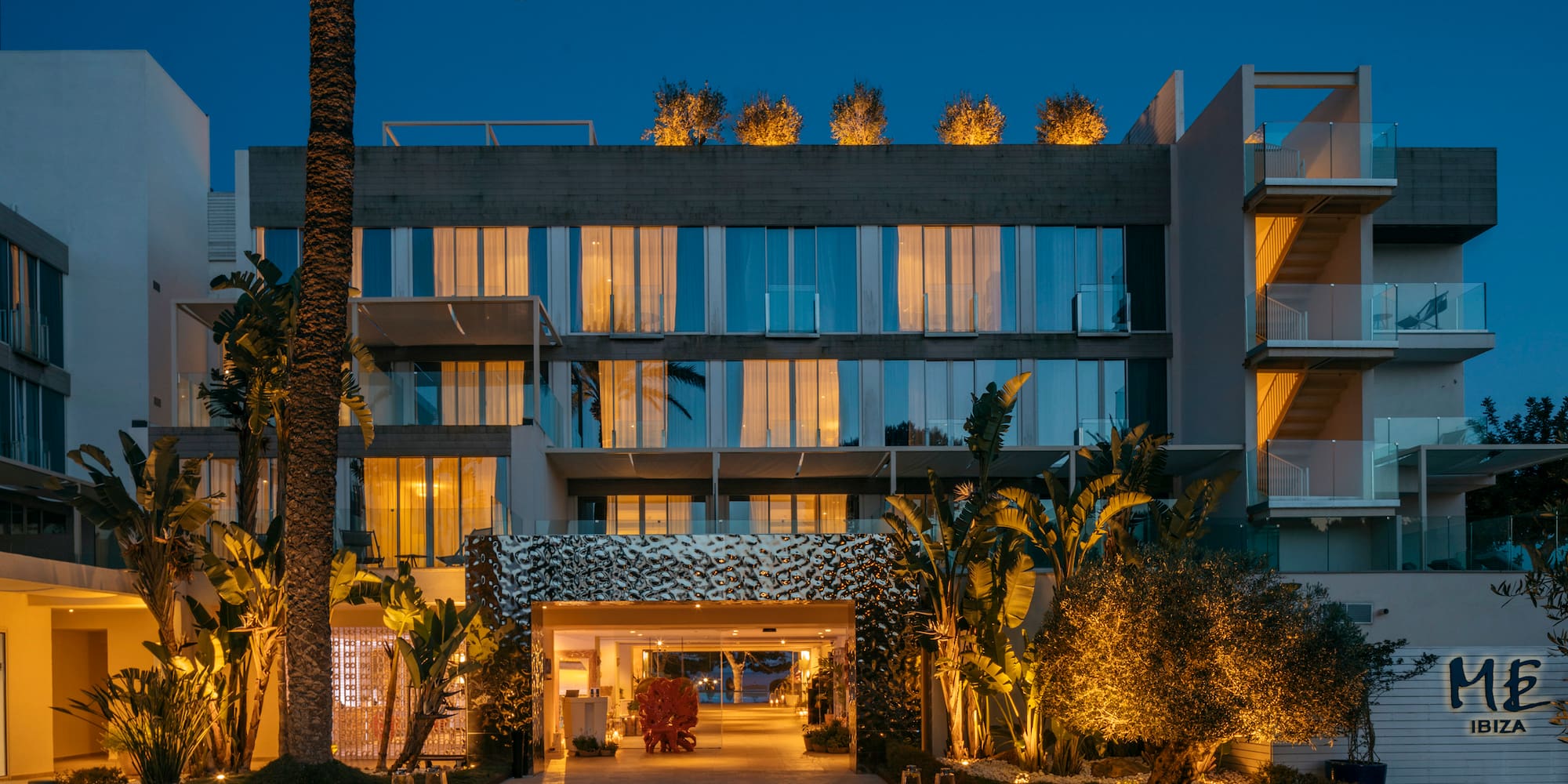 a building with trees and plants