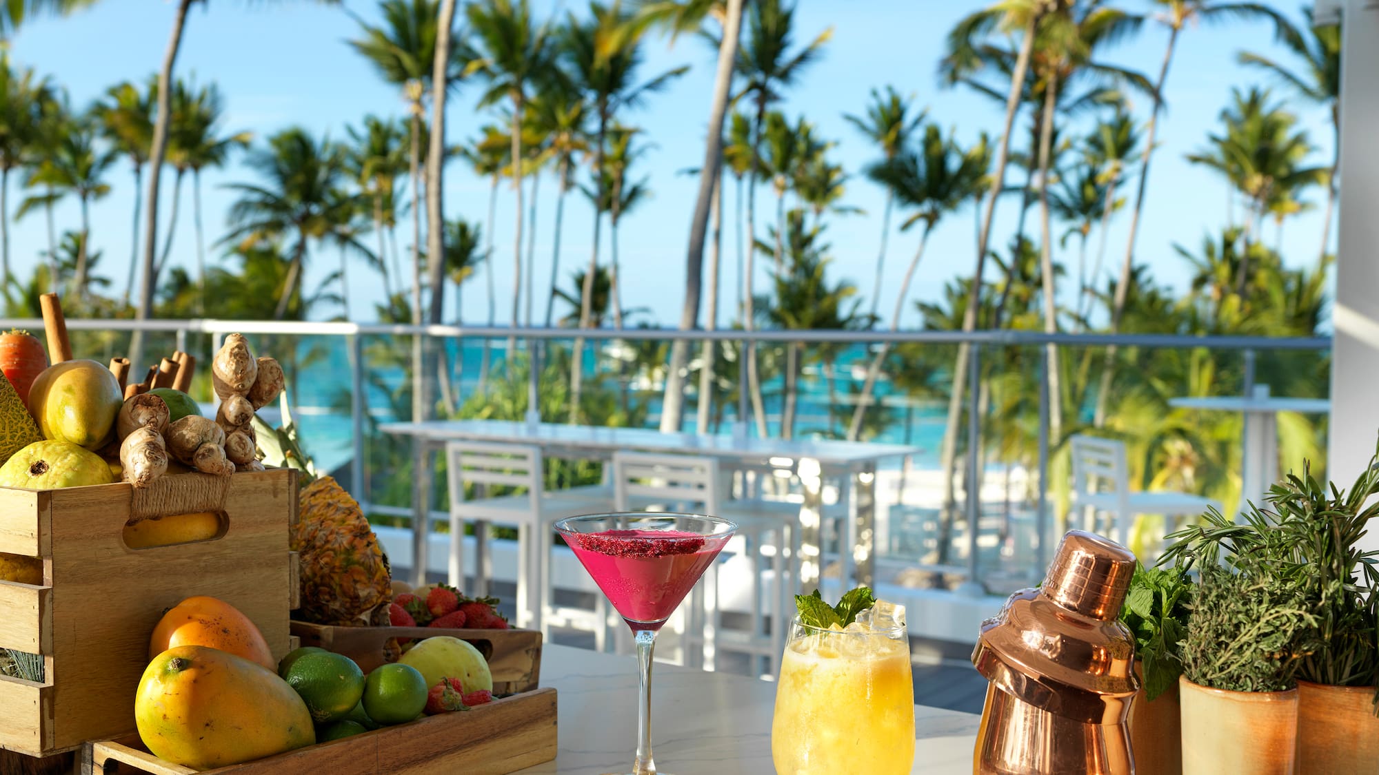 a table with fruit and drinks on it
