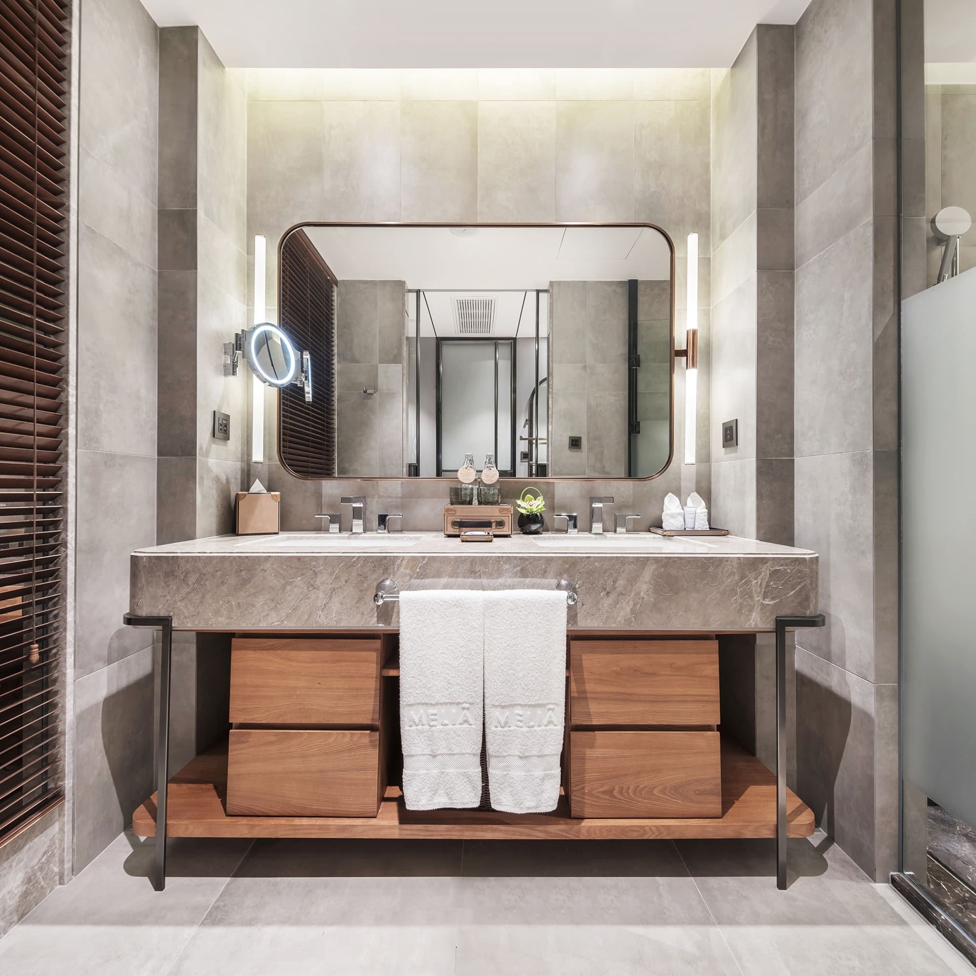 a bathroom with a large mirror and a sink