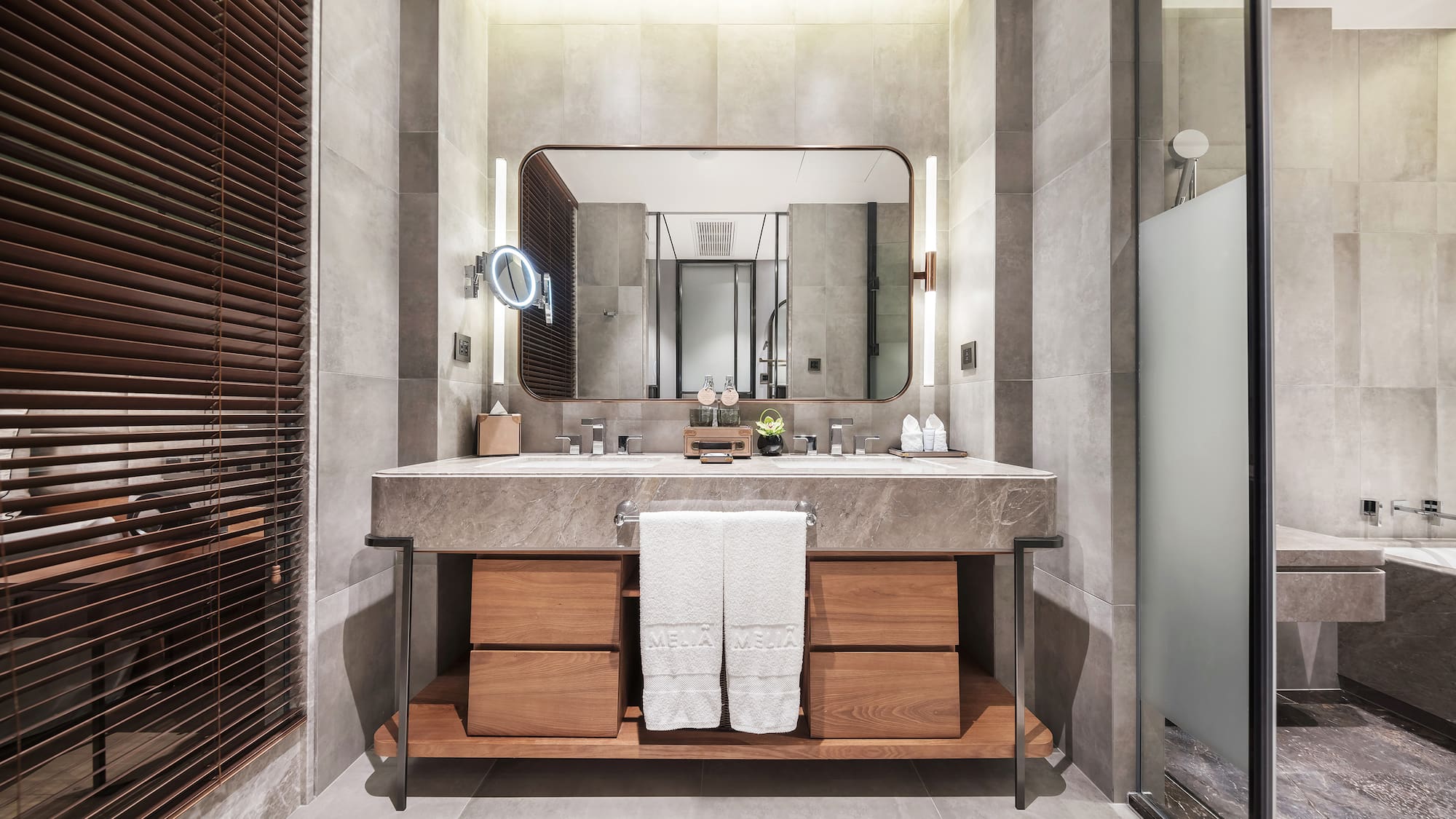 a bathroom with a large mirror and a sink