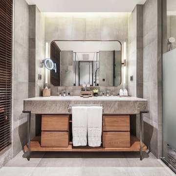 a bathroom with a large mirror and a sink