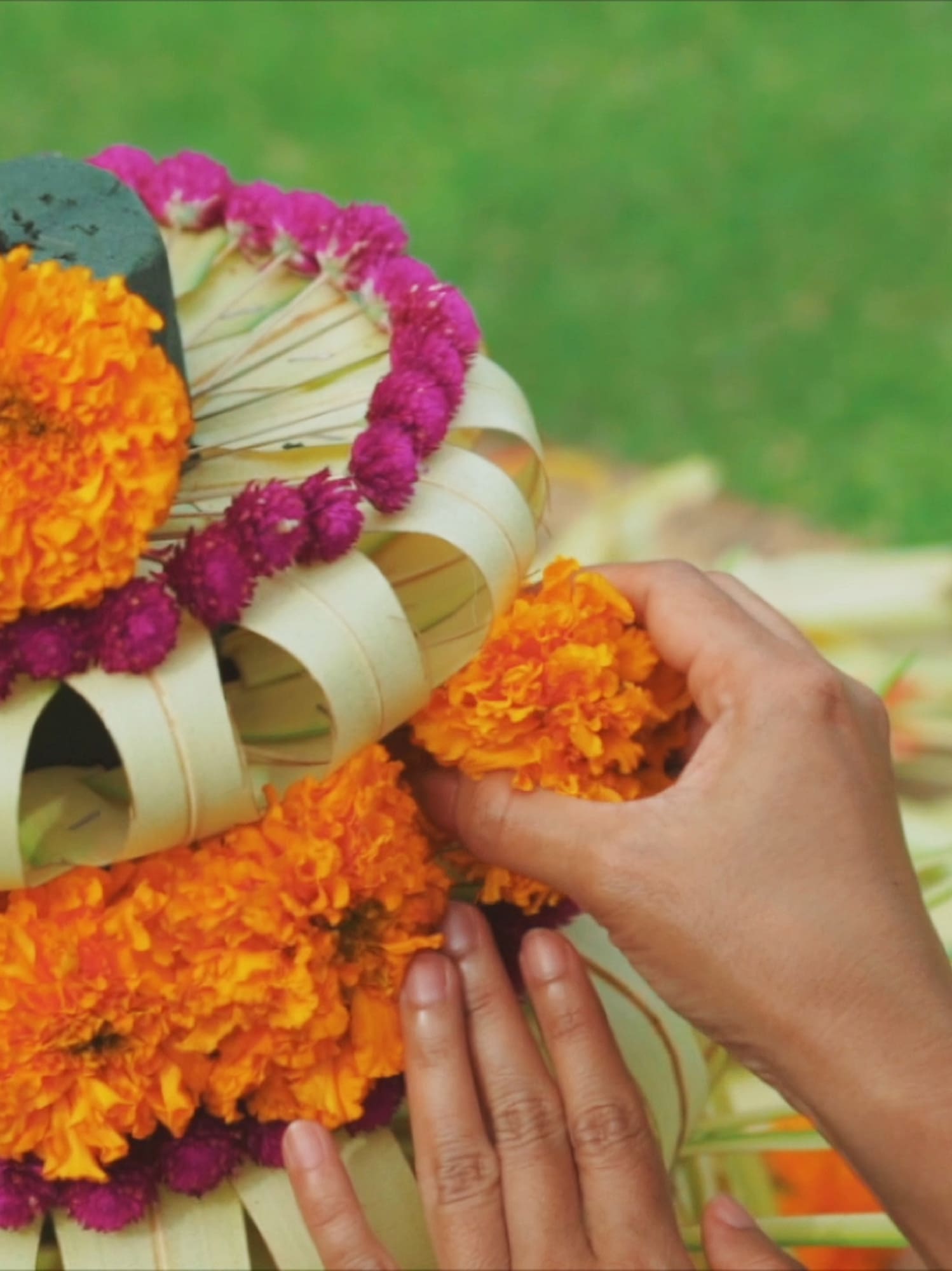 a person making a flower arrangement