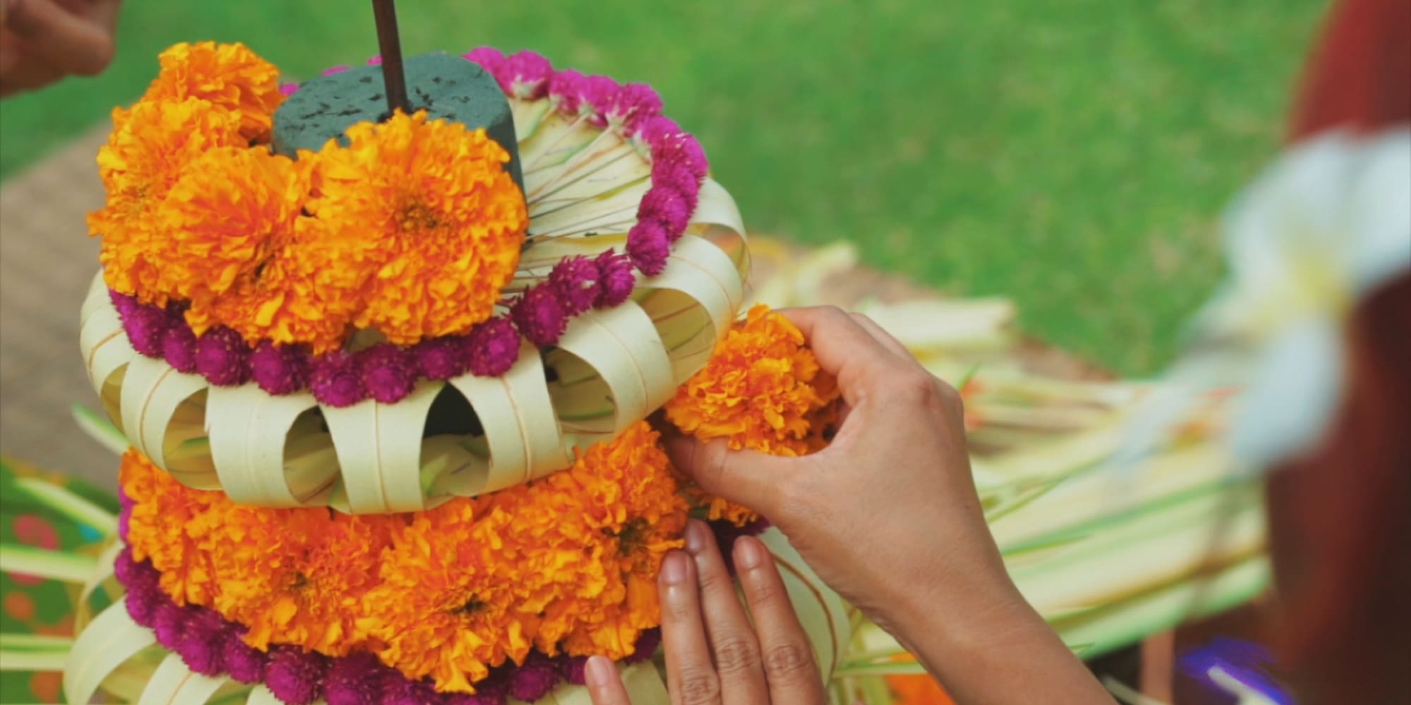 a person making a flower arrangement
