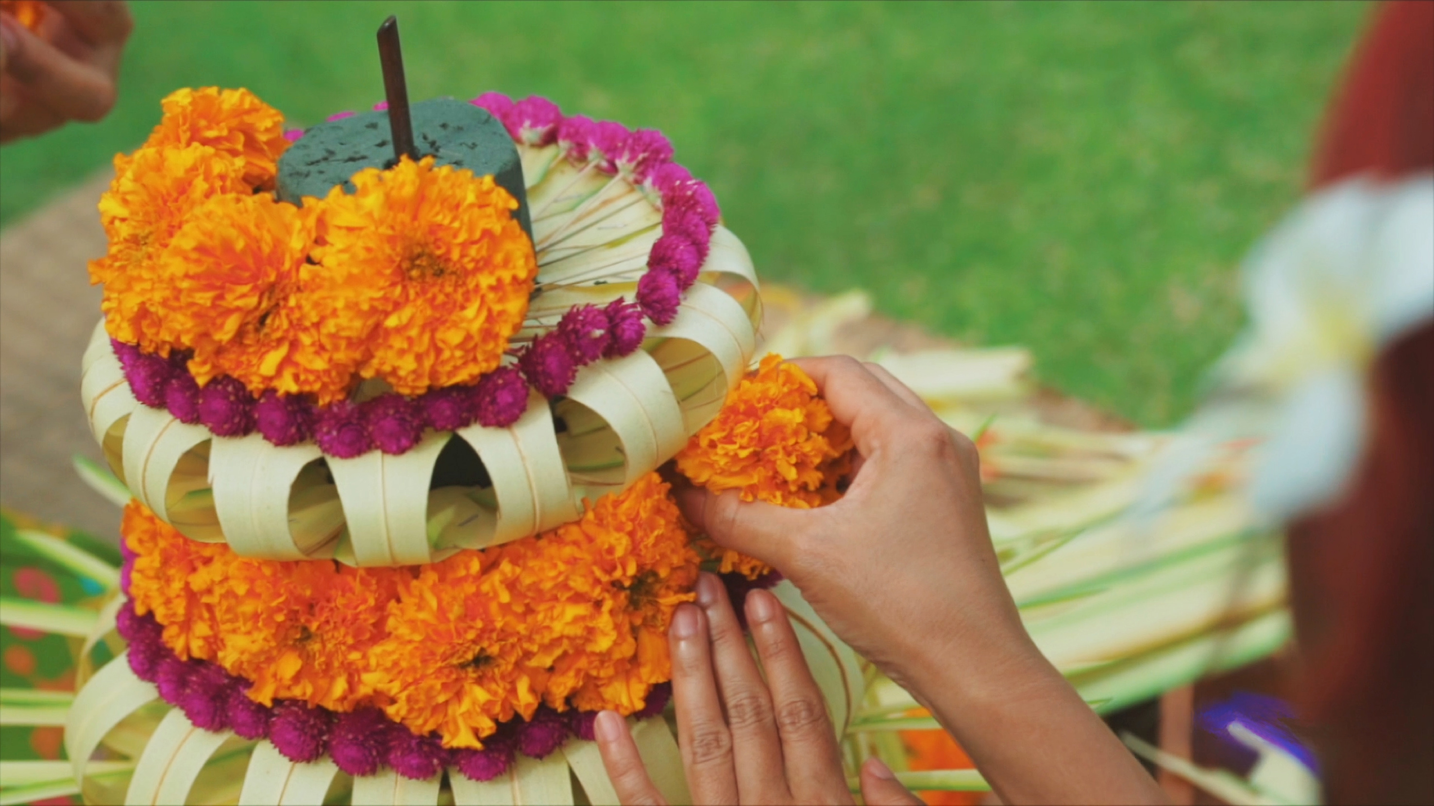 a person making a flower arrangement