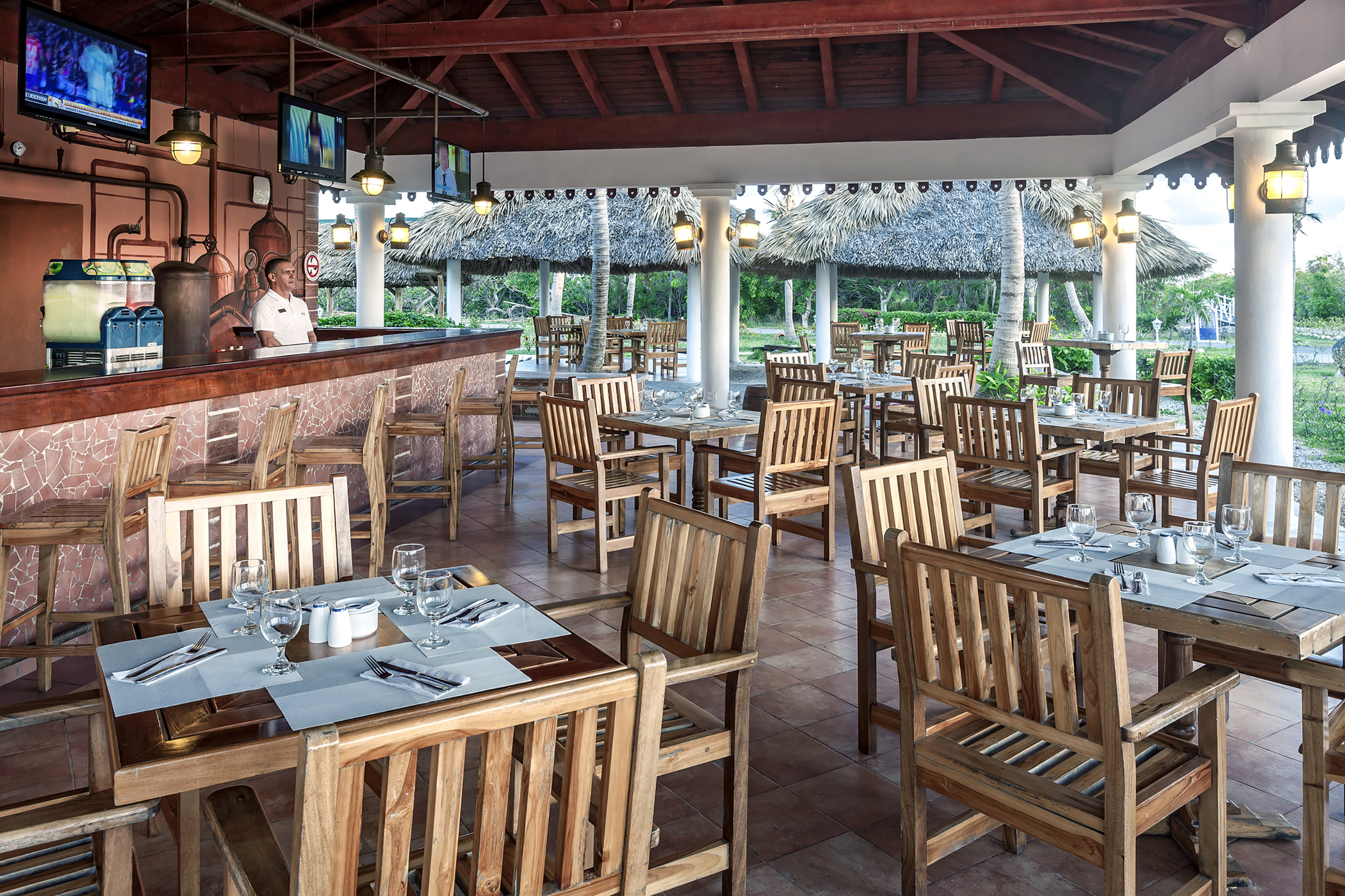 a restaurant with tables and chairs