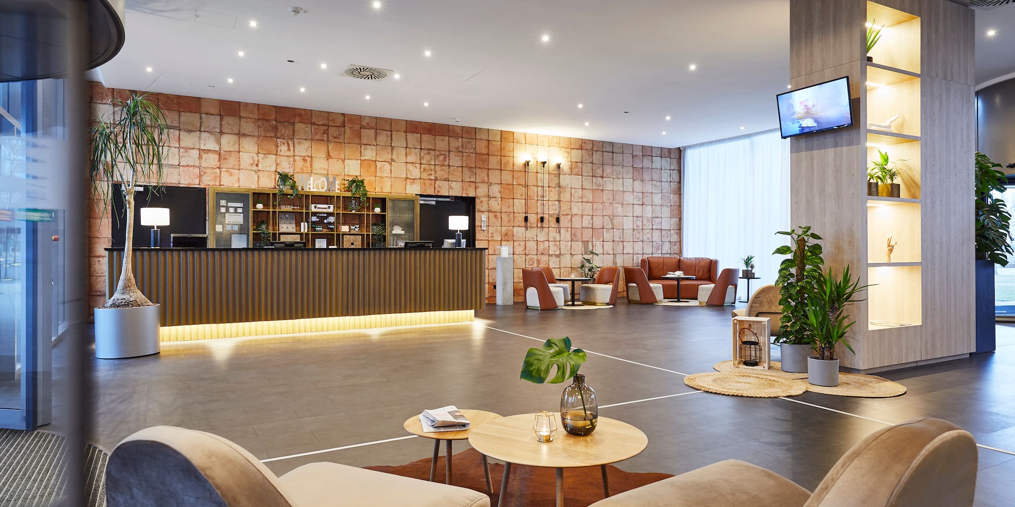 a room with a reception desk and chairs