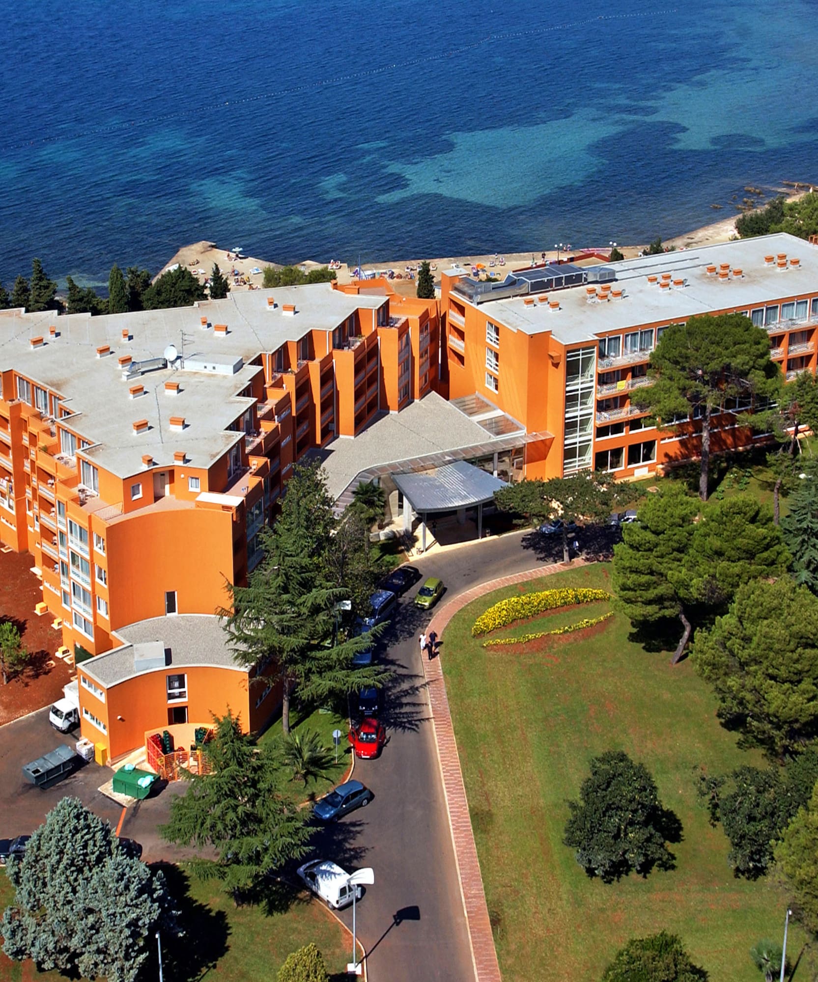 an orange building next to a body of water