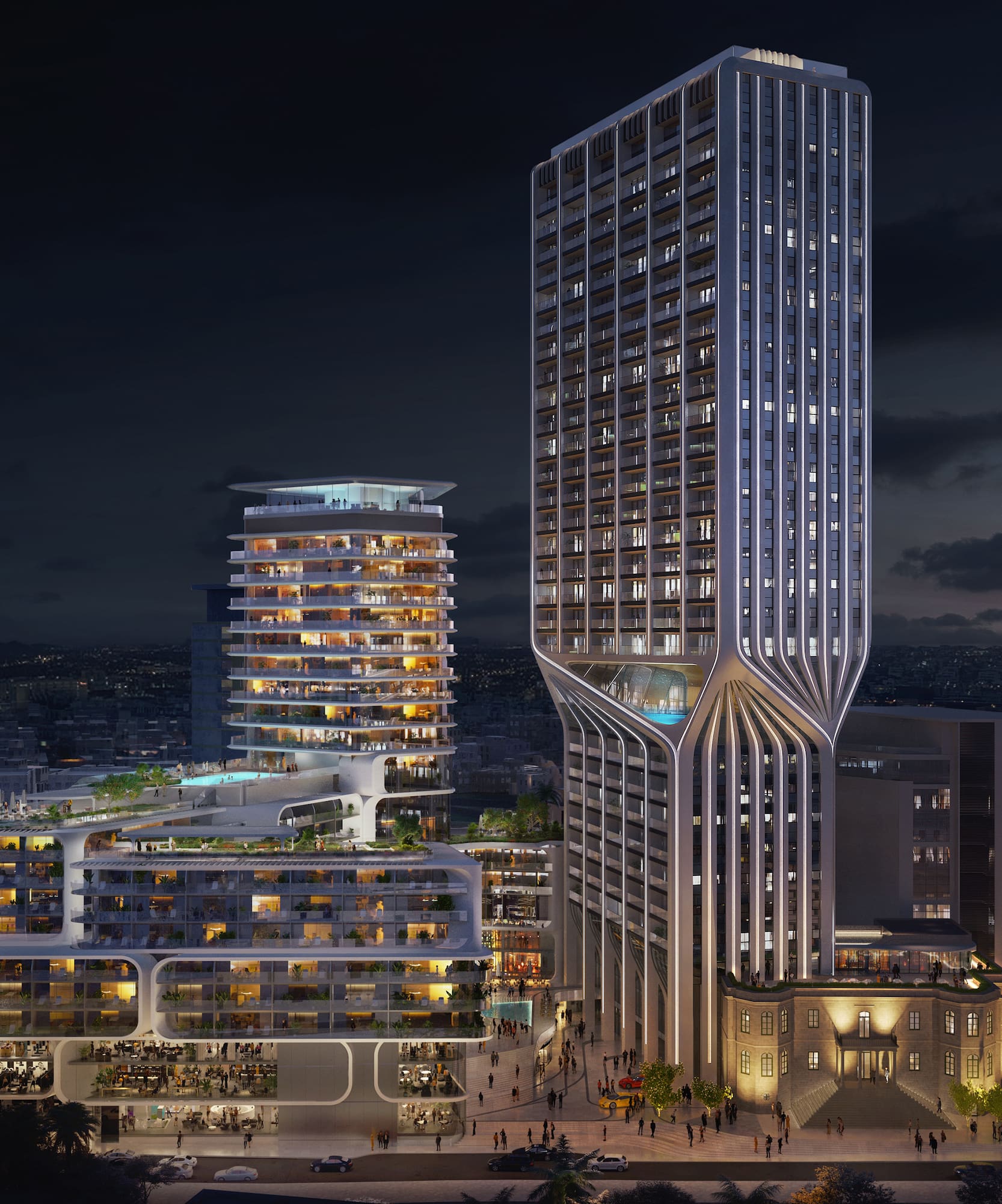 a group of tall buildings with lights