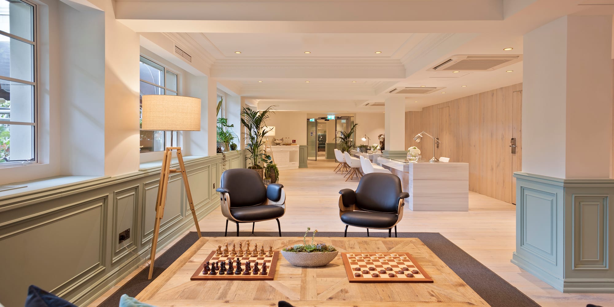 a room with a chess board and chairs