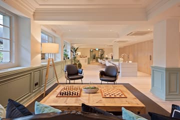 a room with a chess board and chairs