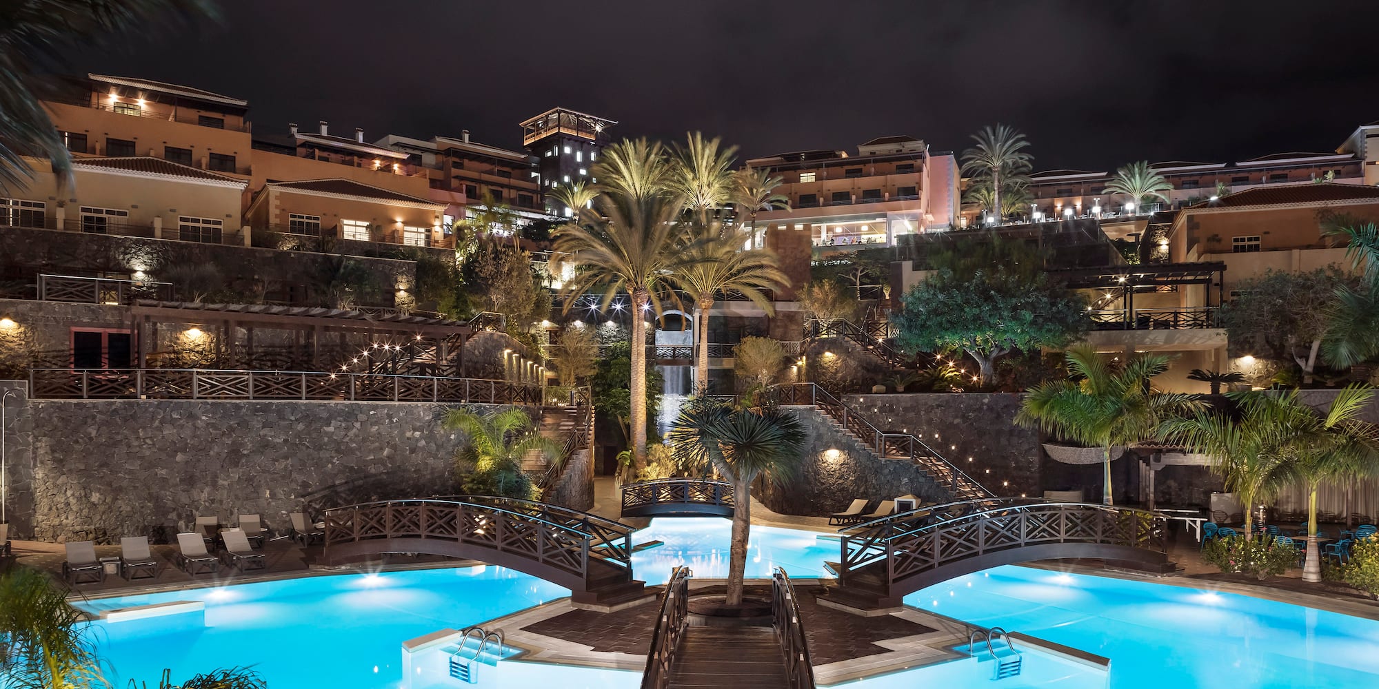 a swimming pool with a bridge over it