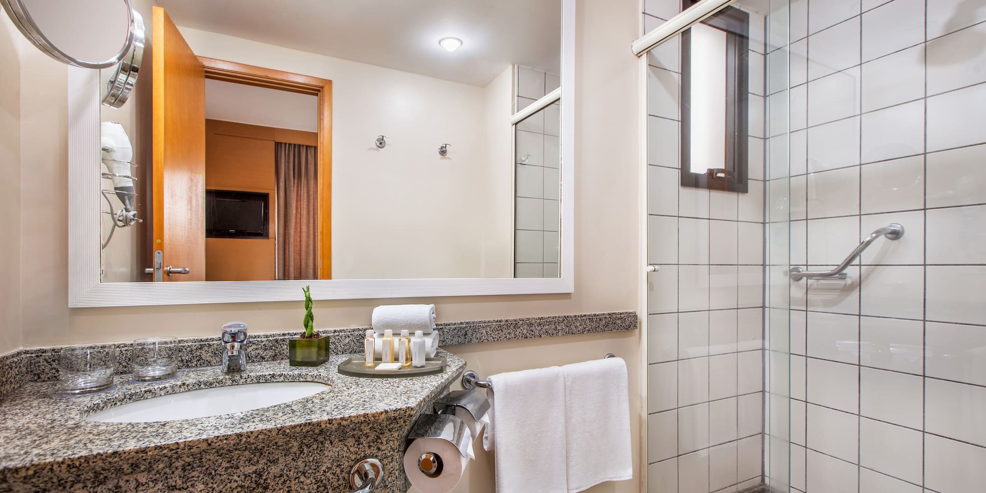 a bathroom with a mirror and sink