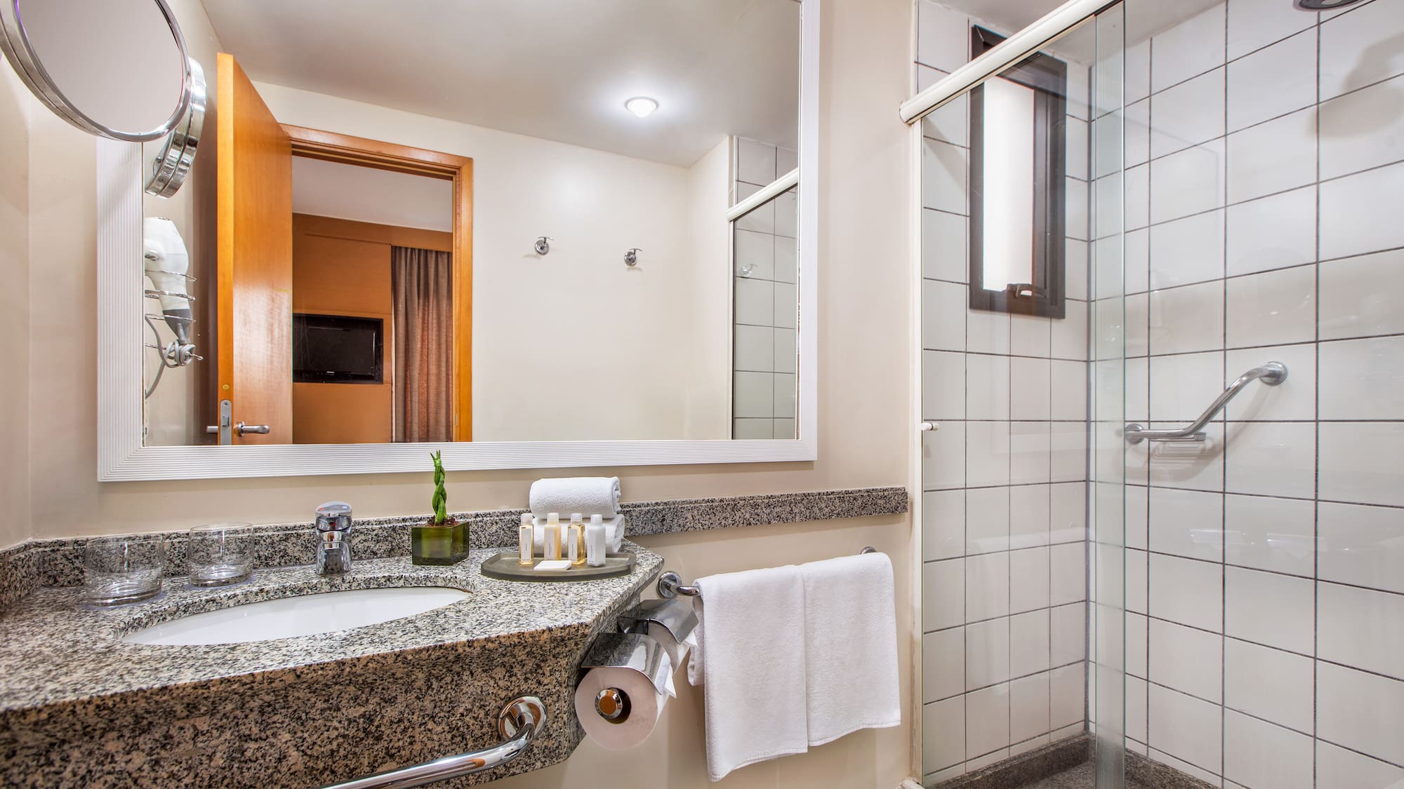 a bathroom with a mirror and sink