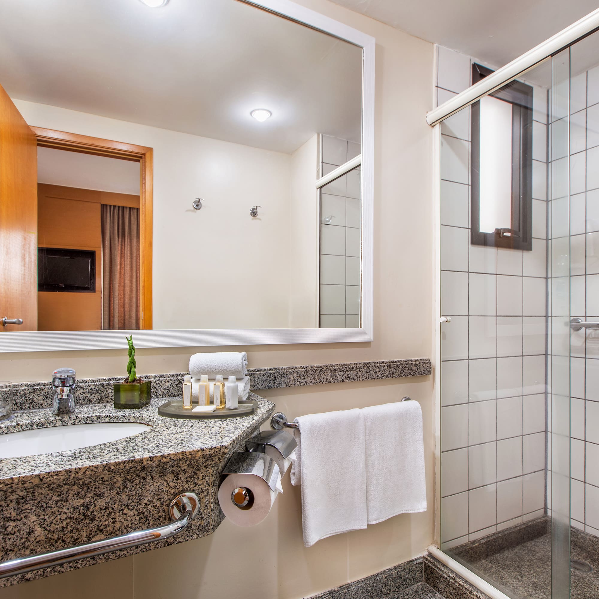 a bathroom with a mirror and sink