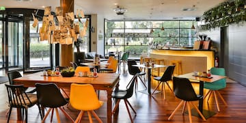 a restaurant with tables and chairs